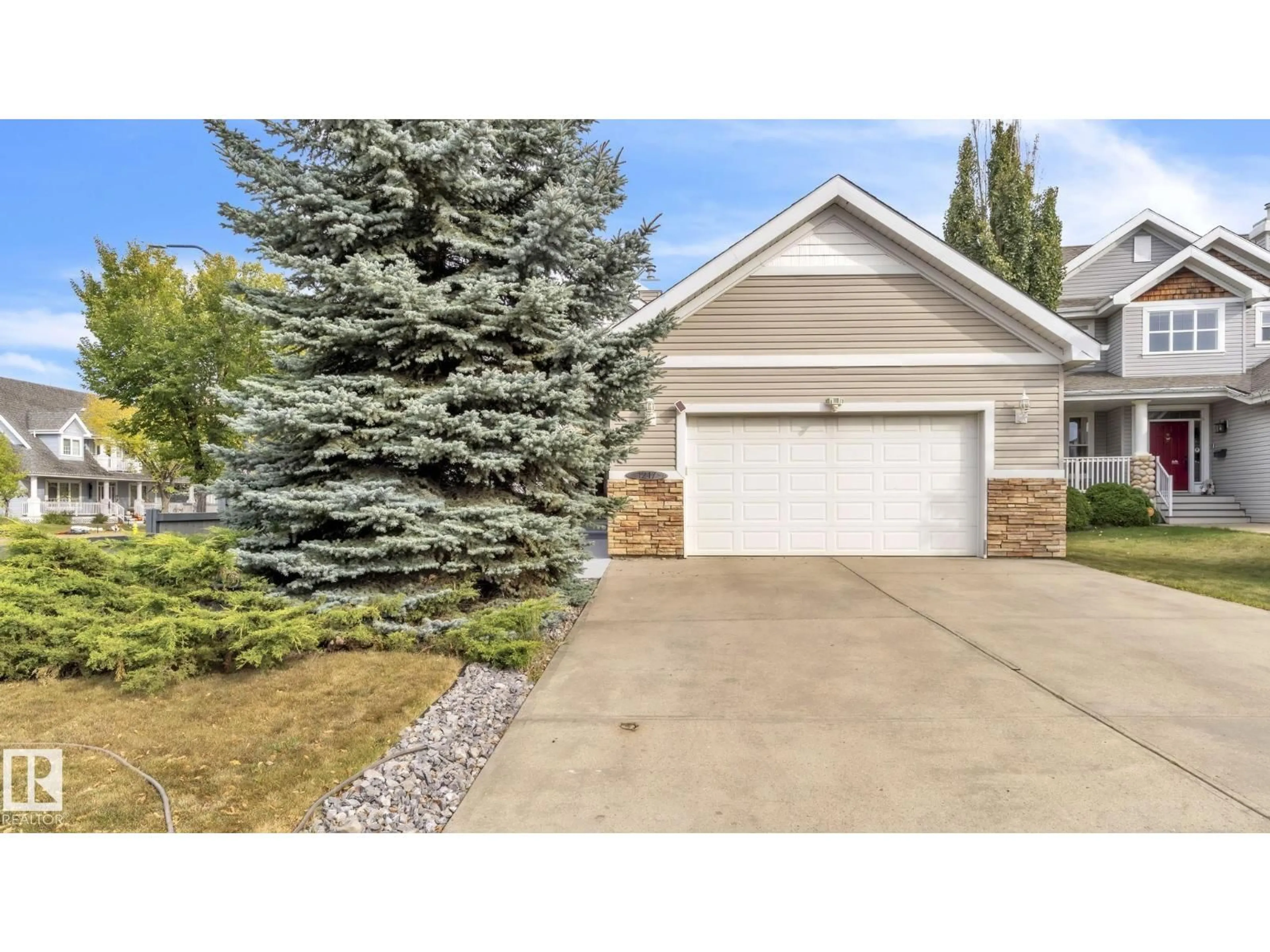 Home with vinyl exterior material, street for 1217 SUMMERSIDE DR, Edmonton Alberta T6X1C5
