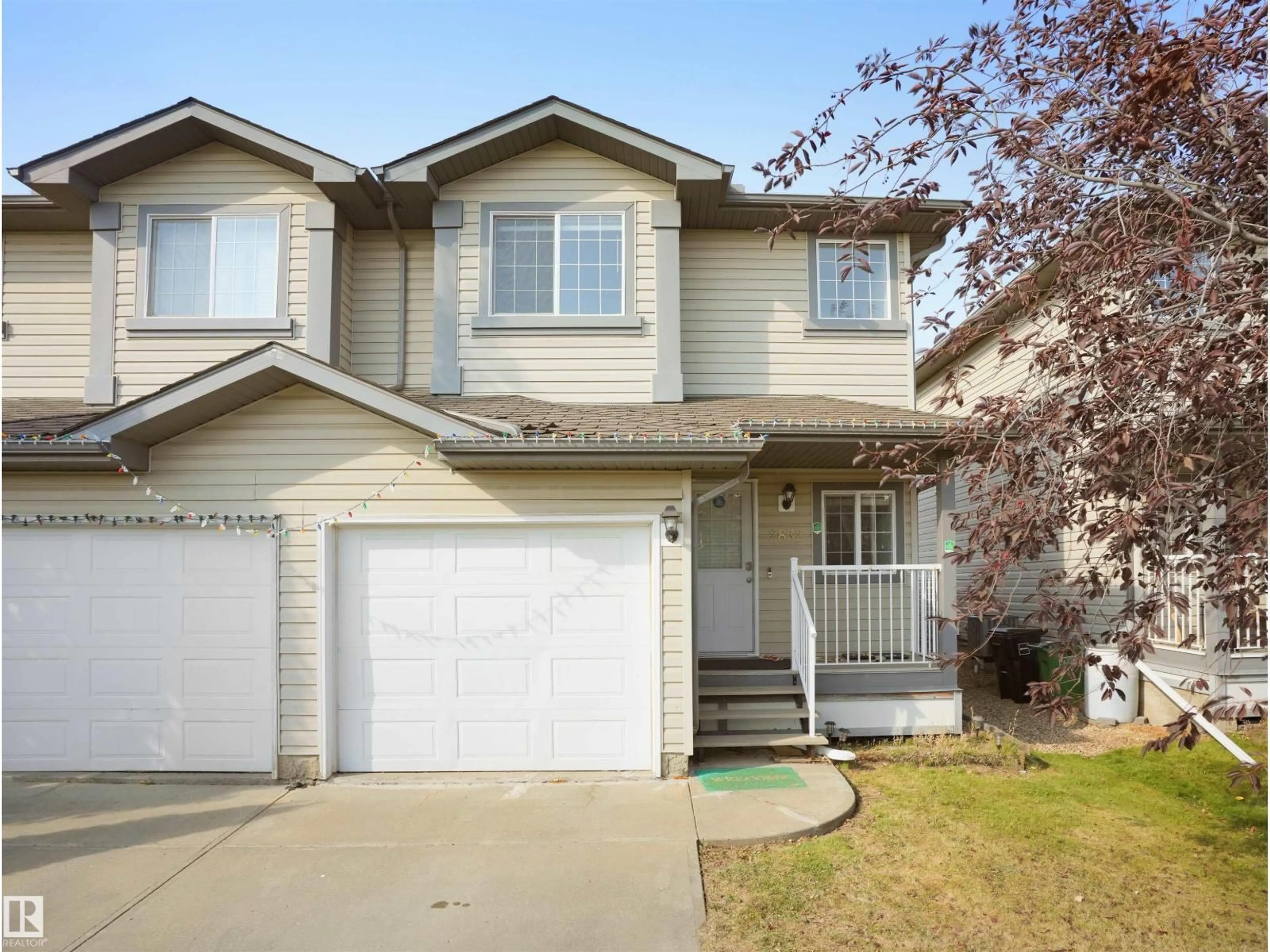 Home with vinyl exterior material, street for 2832 26 ST, Edmonton Alberta T6T2A2