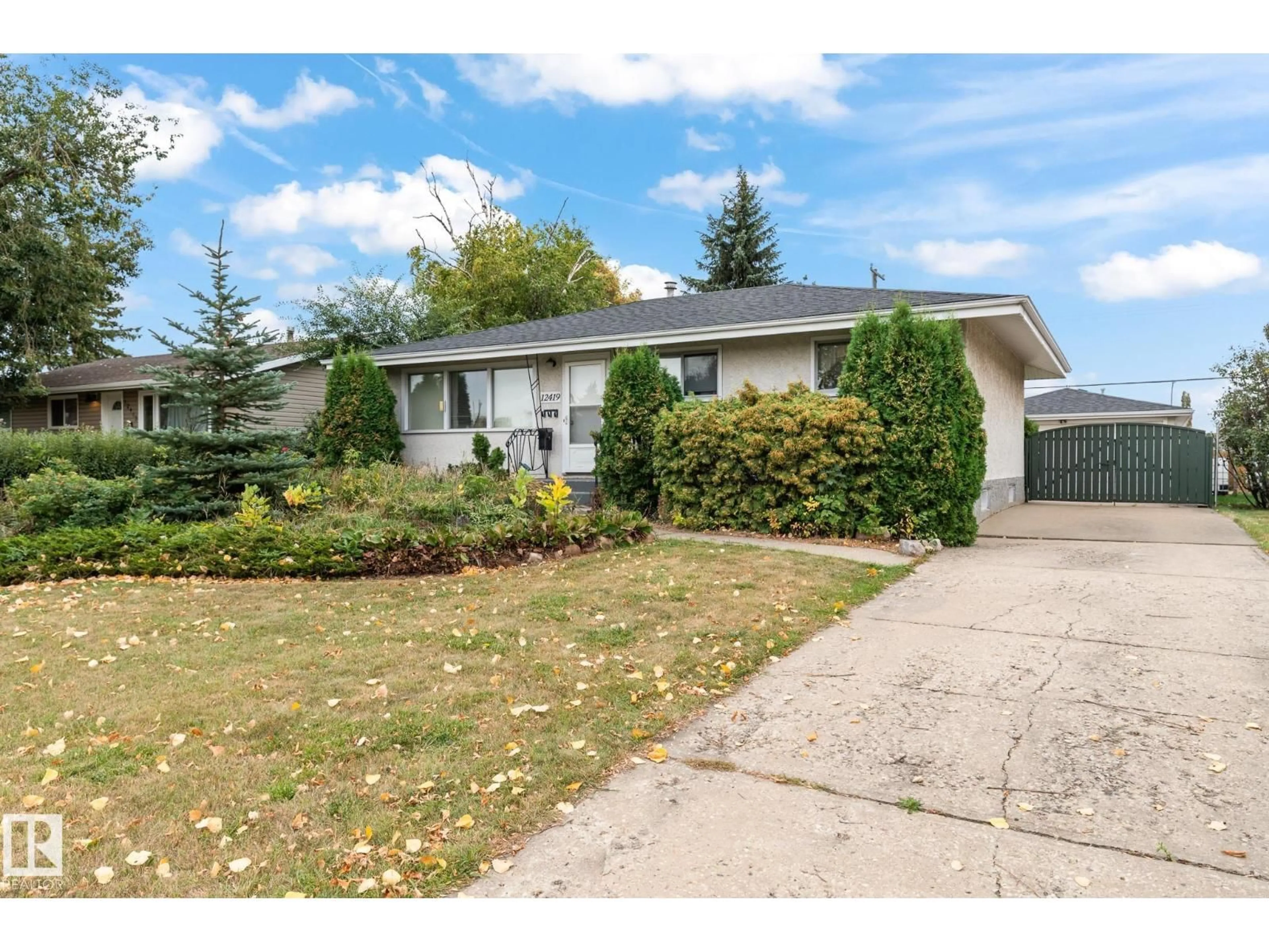 Home with vinyl exterior material, street for 12419 135A AV, Edmonton Alberta T5L3Z4
