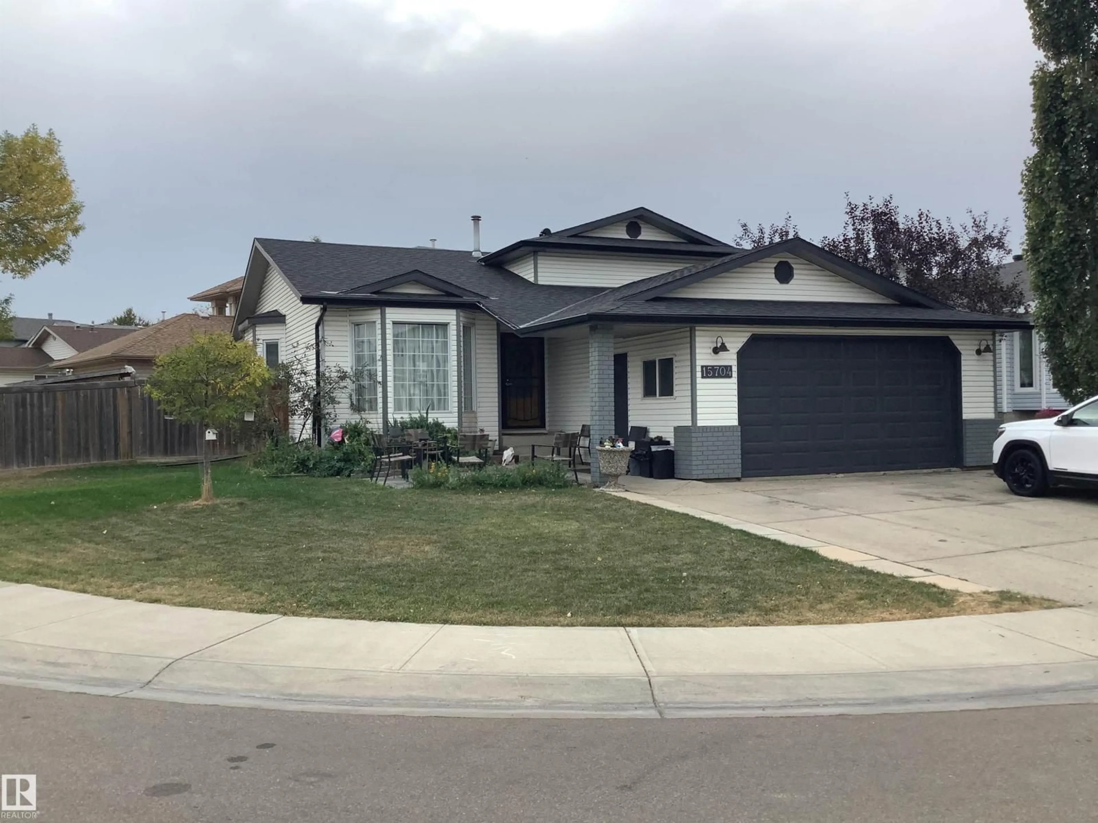 Home with vinyl exterior material, street for 15704 61 ST NW, Edmonton Alberta T5P2P5