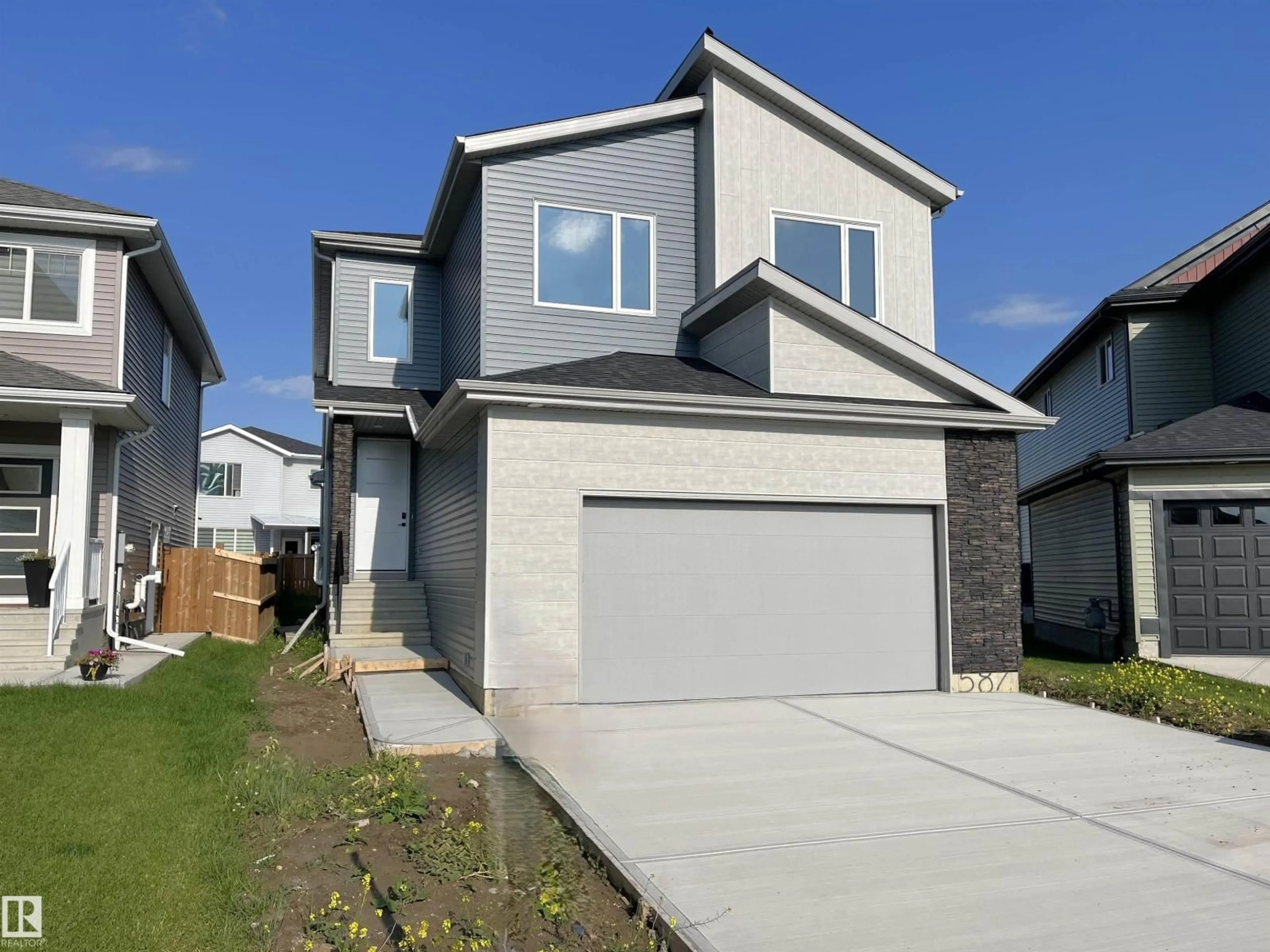 Home with vinyl exterior material, street for 587 BOULDER WD, Leduc Alberta T9E1M1