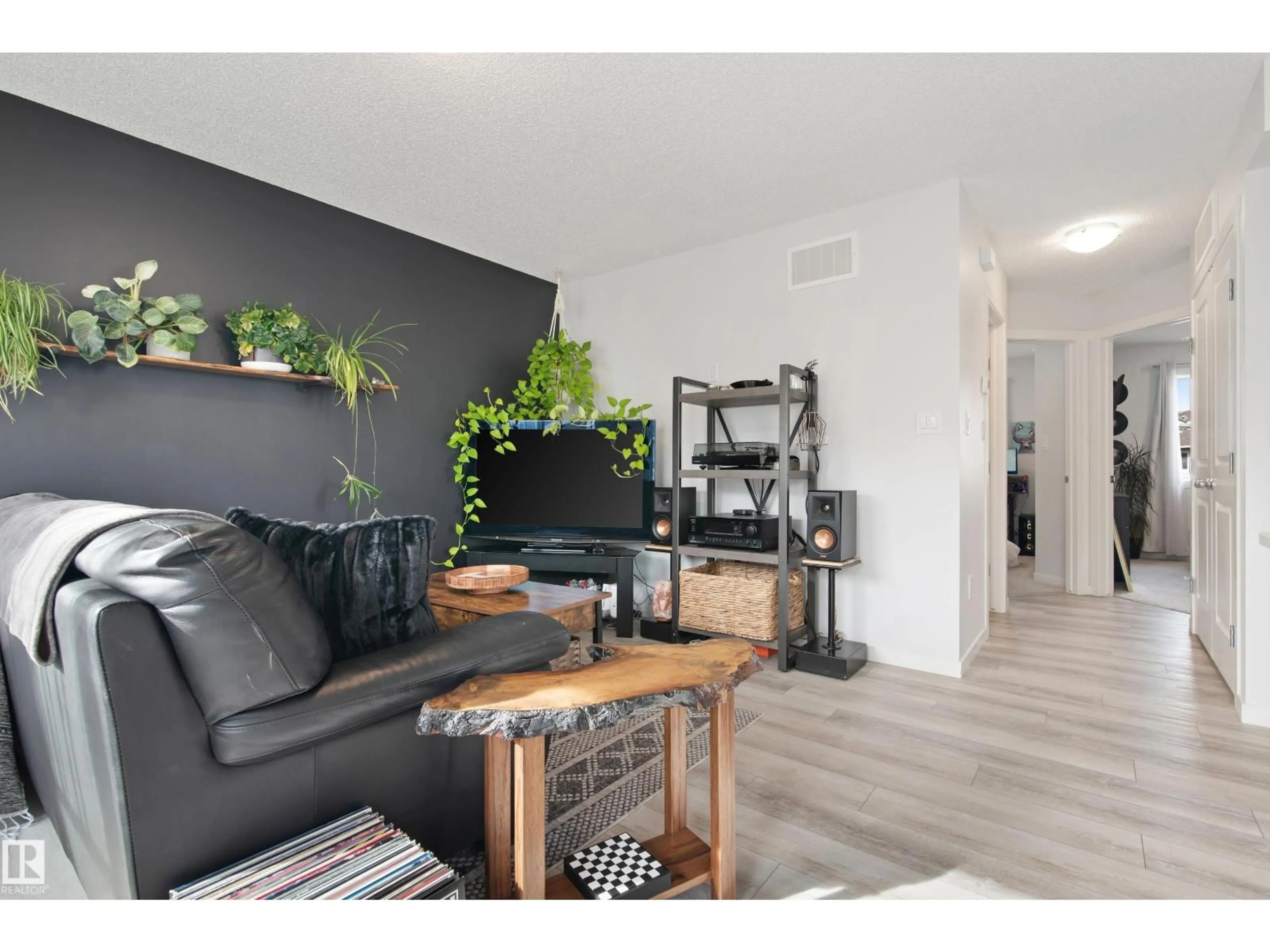 Living room with furniture, wood/laminate floor for 84 - 17832 78 ST, Edmonton Alberta T5Z0P7