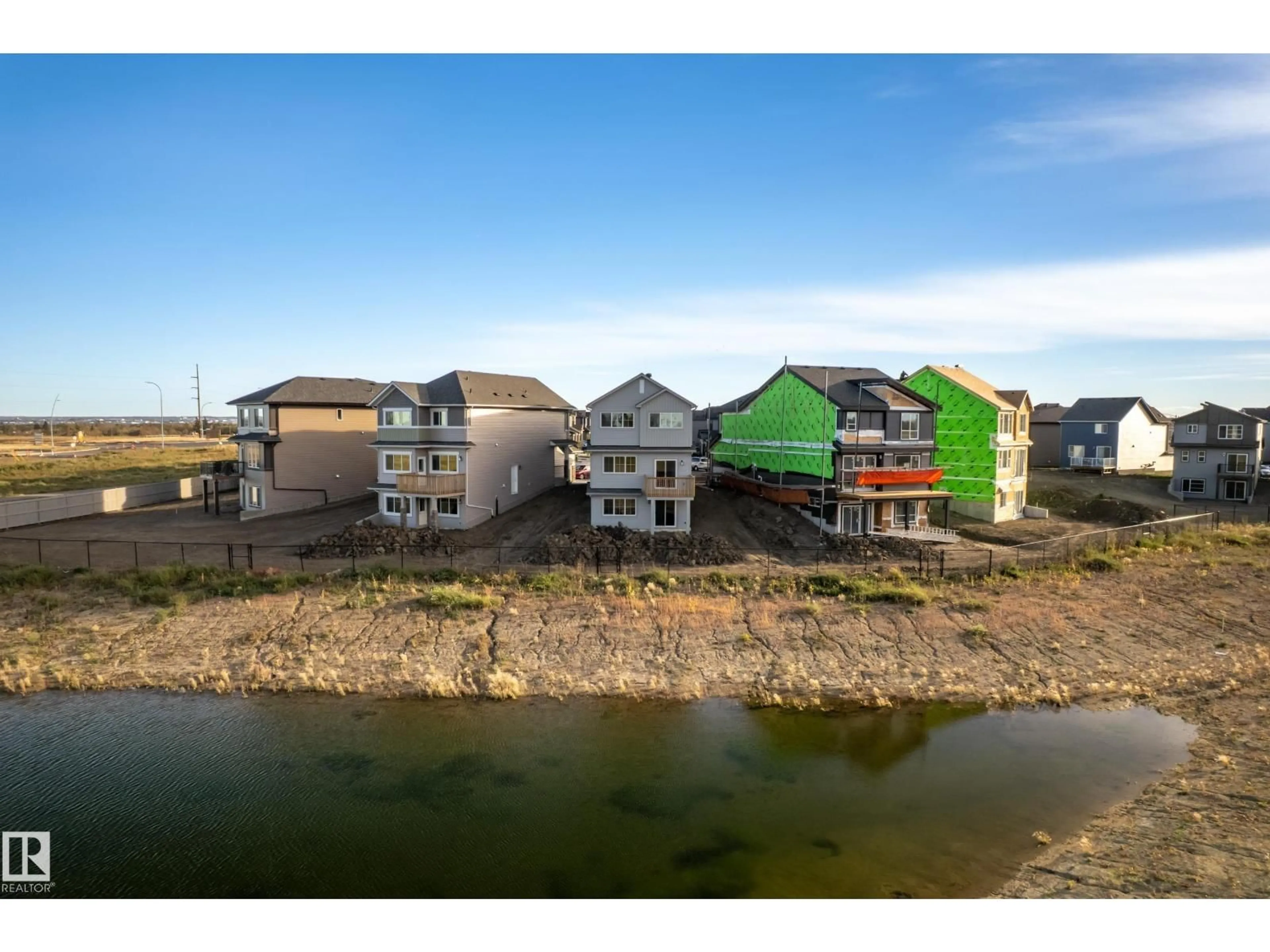 A pic from outside/outdoor area/front of a property/back of a property/a pic from drone, water/lake/river/ocean view for NW - 17448 2 ST, Edmonton Alberta T5Y4G6