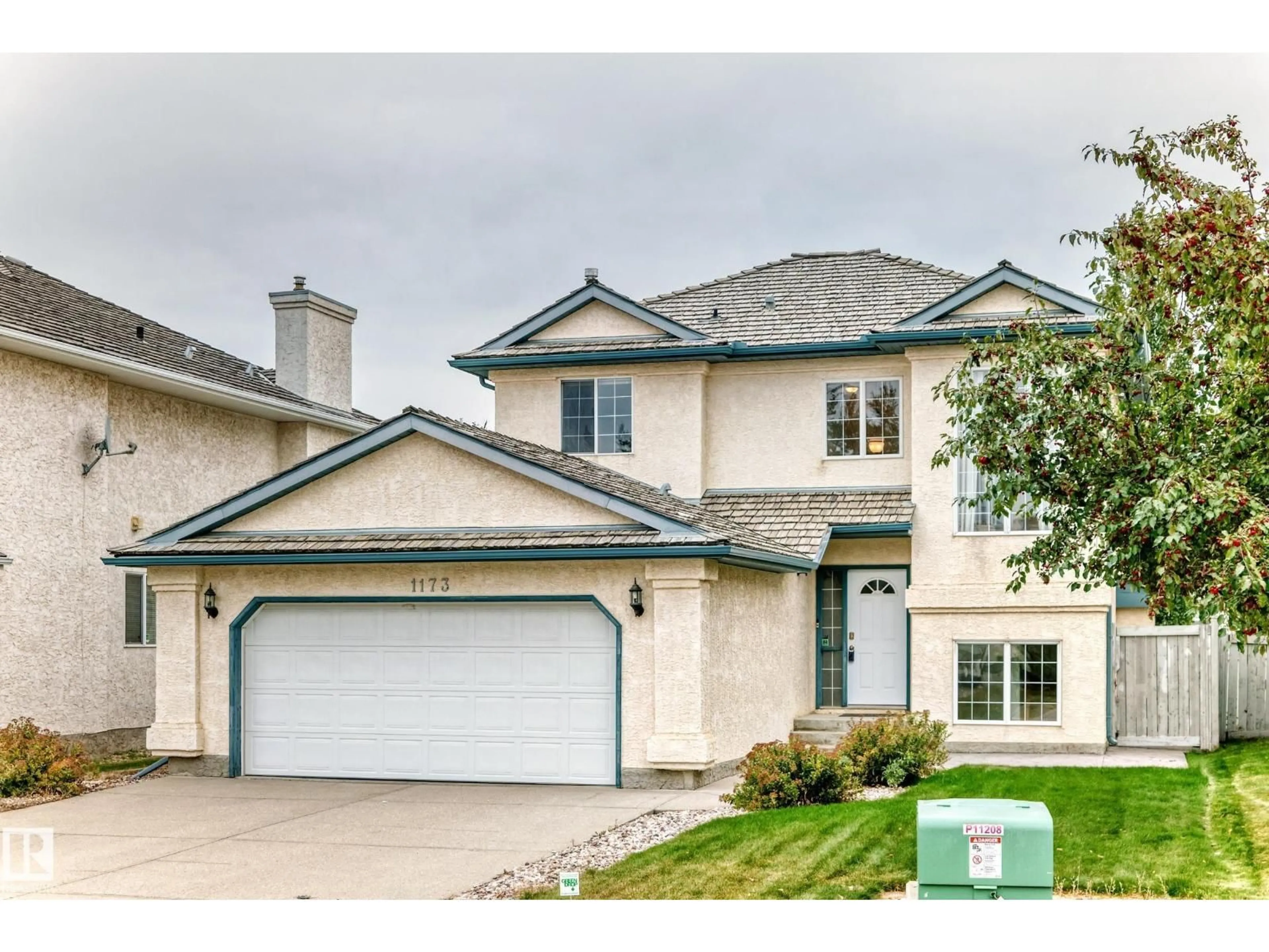 Home with vinyl exterior material, street for 1173 CARTER CREST RD, Edmonton Alberta T6R2L8