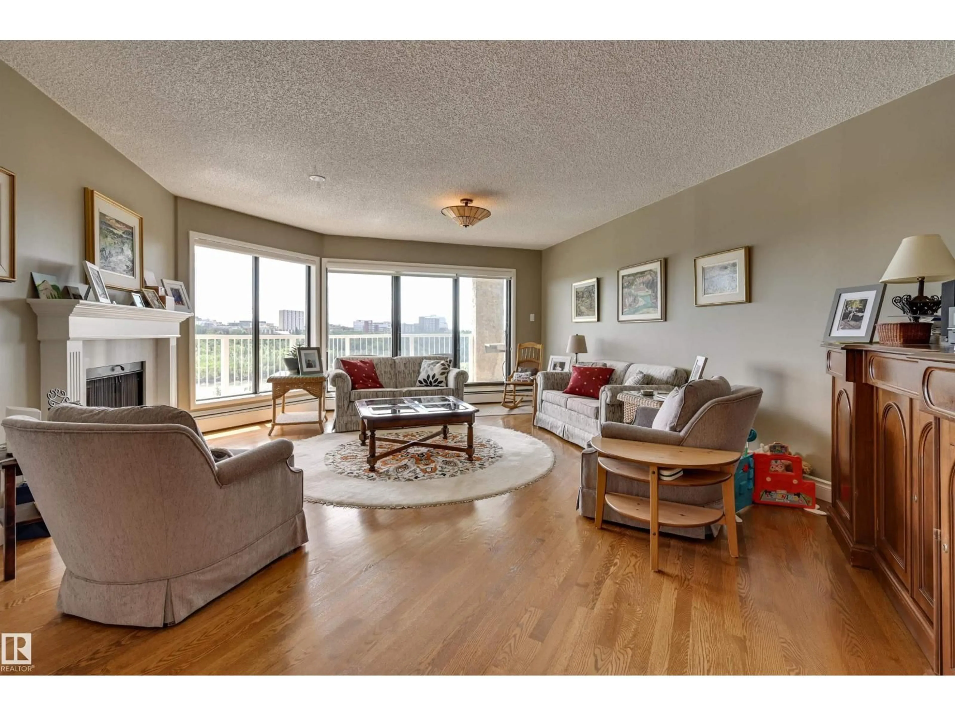 Living room with furniture, wood/laminate floor for #10 - 9734 111 ST, Edmonton Alberta T5K1J8