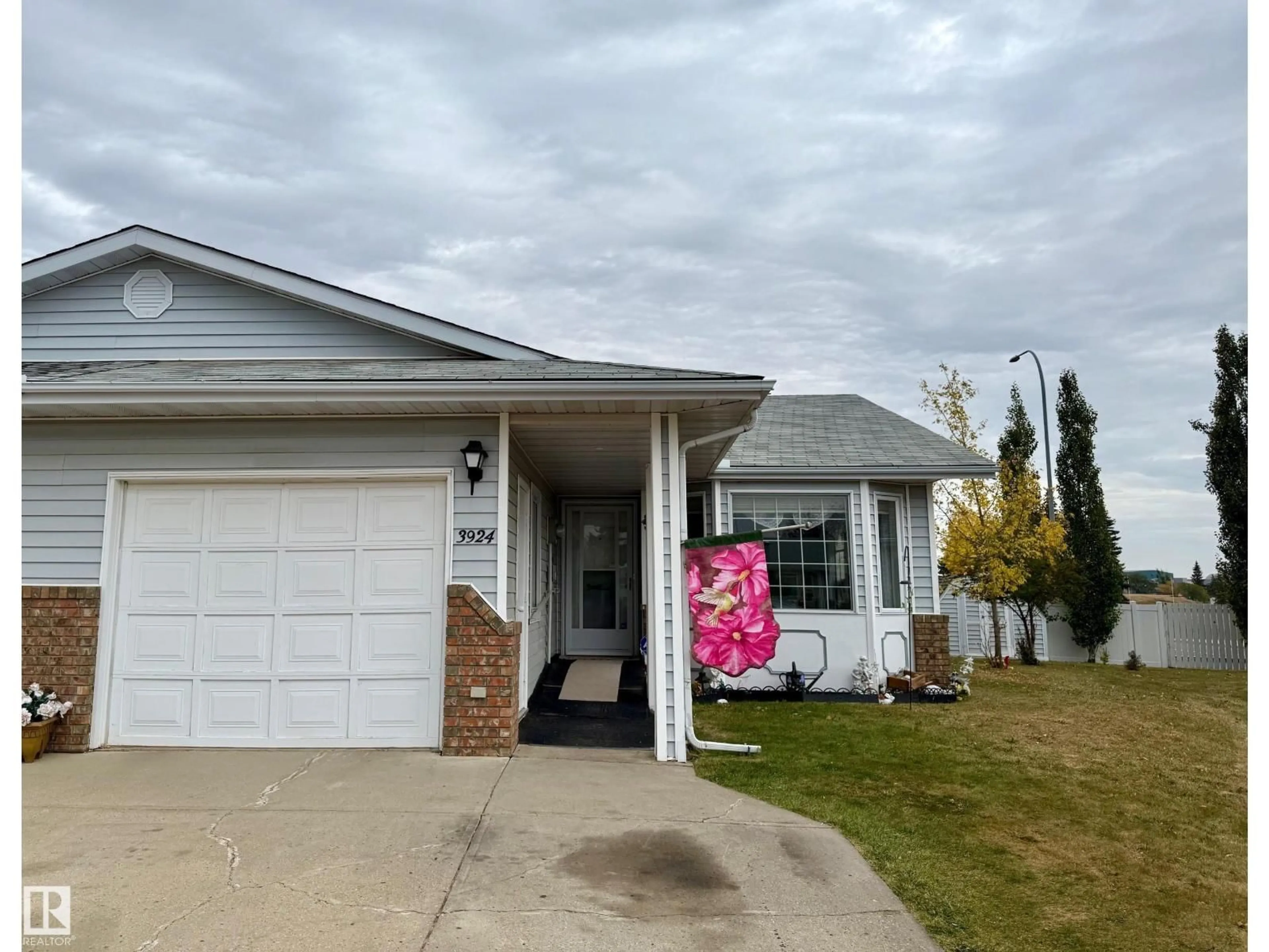 Home with vinyl exterior material, street for CL - 3924 56A STREET, Camrose Alberta T4V4L1