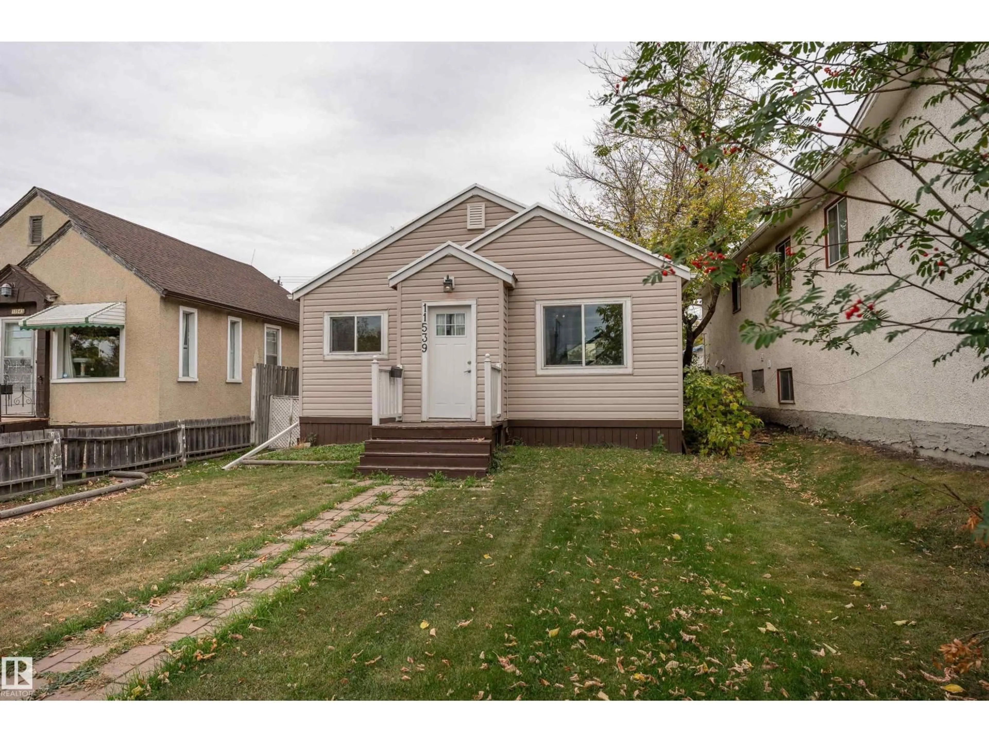 Home with vinyl exterior material, street for NW - 11539 101 ST, Edmonton Alberta T5G2B2