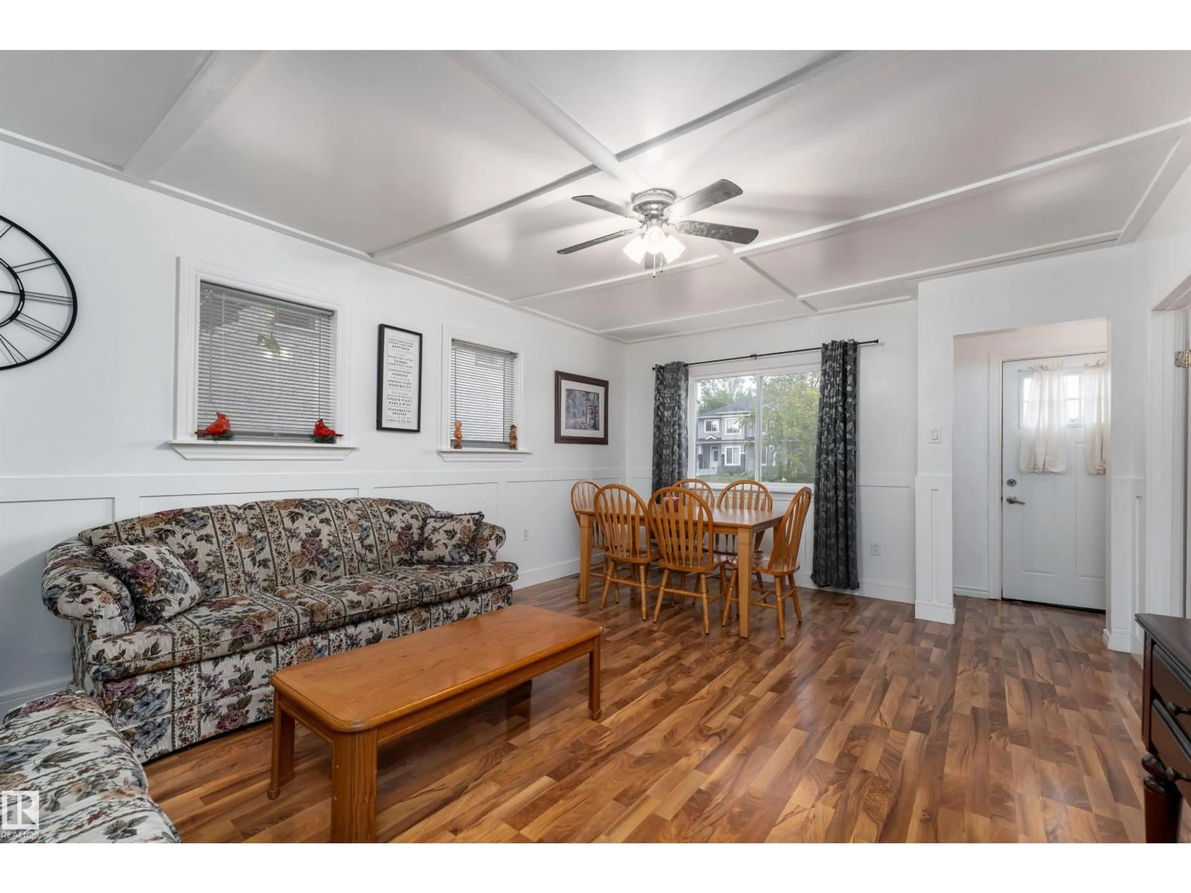 Living room with furniture, wood/laminate floor for NW - 11539 101 ST, Edmonton Alberta T5G2B2
