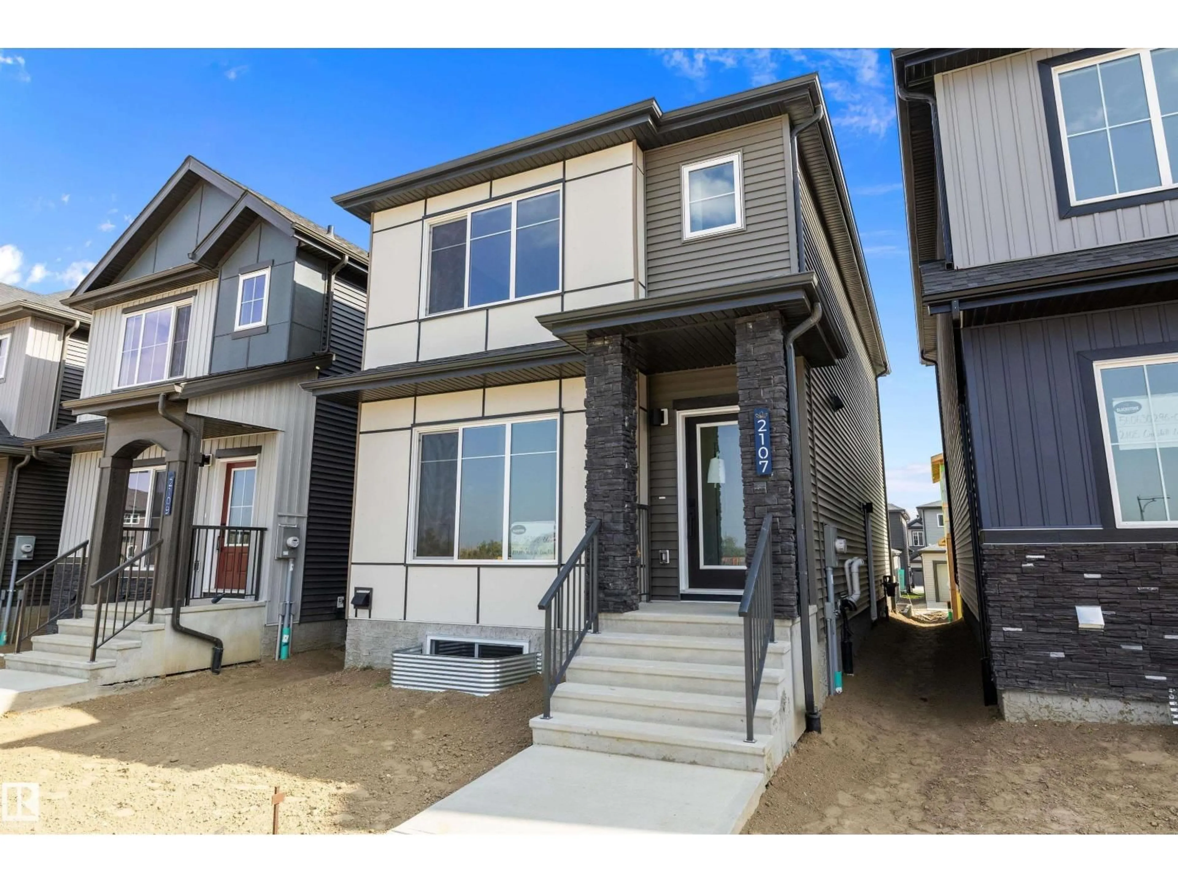 Home with vinyl exterior material, street for 2107 CROSSBILL LN, Edmonton Alberta T5S0T9