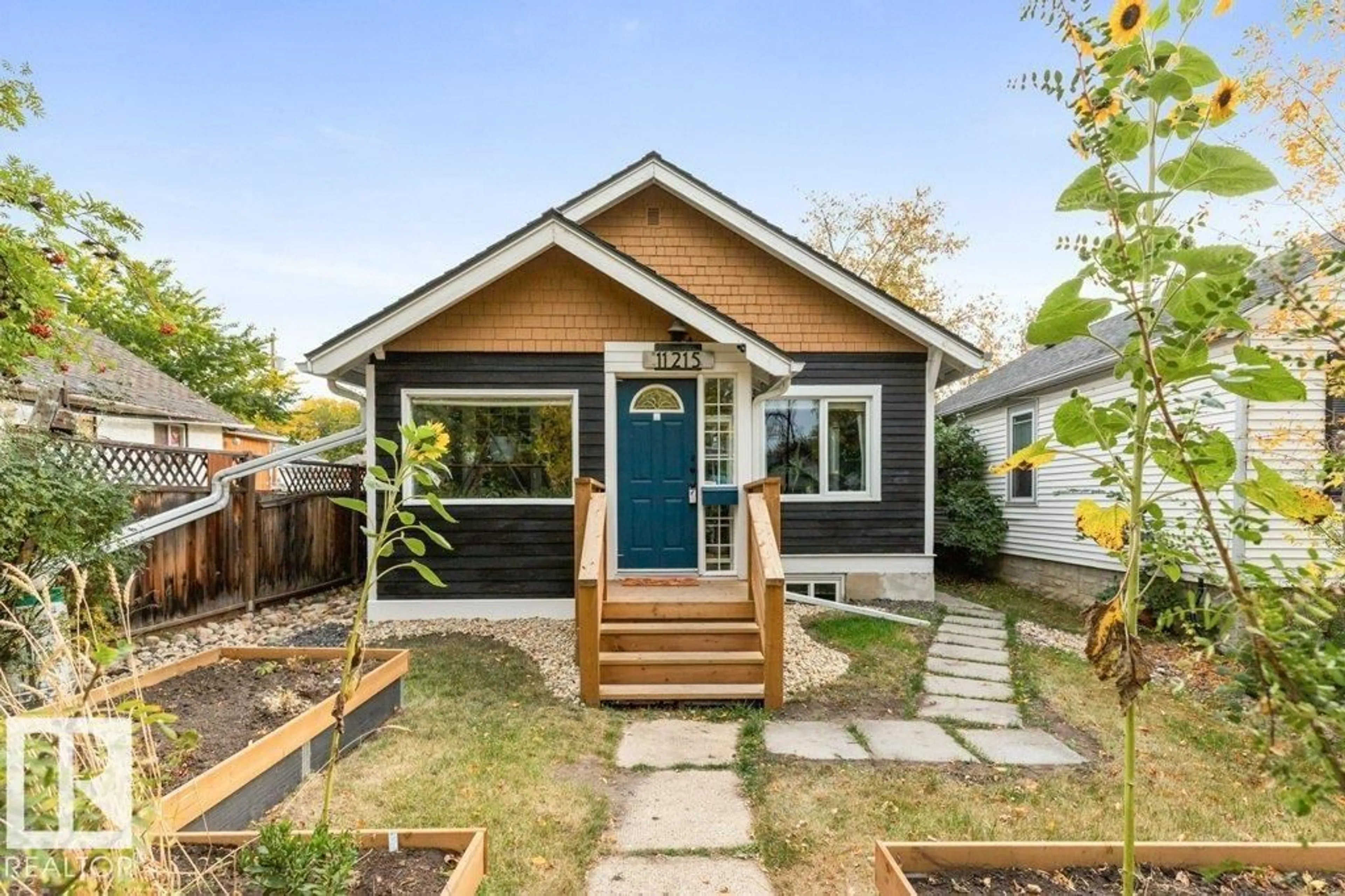 Home with vinyl exterior material, street for NW - 11215 67 ST, Edmonton Alberta T5B1K9