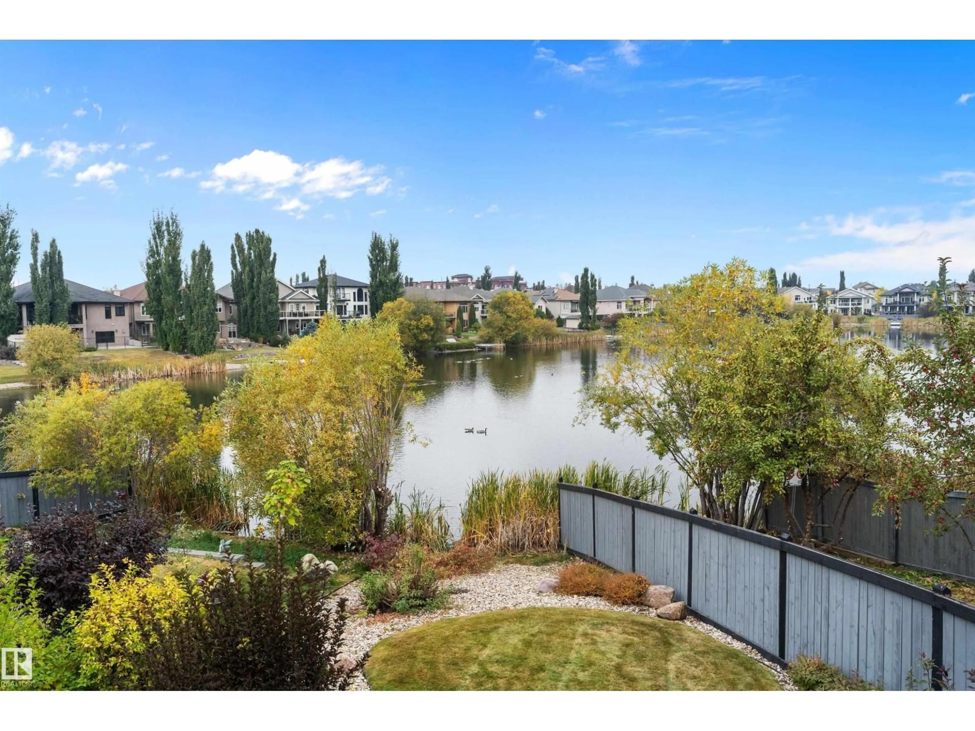 A pic from outside/outdoor area/front of a property/back of a property/a pic from drone, water/lake/river/ocean view for 46 SHORES DR, Leduc Alberta T9E8N7