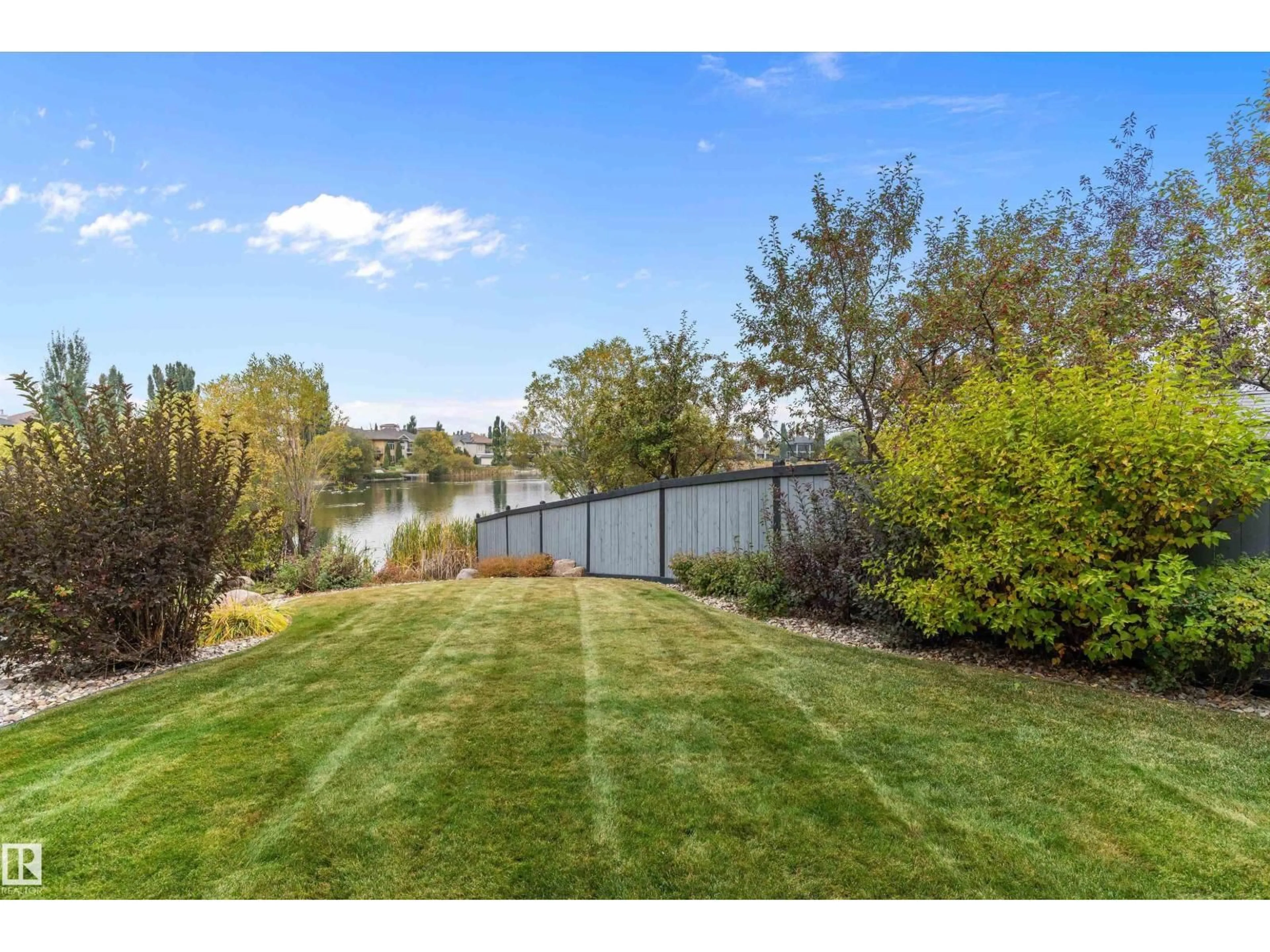 A pic from outside/outdoor area/front of a property/back of a property/a pic from drone, water/lake/river/ocean view for 46 SHORES DR, Leduc Alberta T9E8N7
