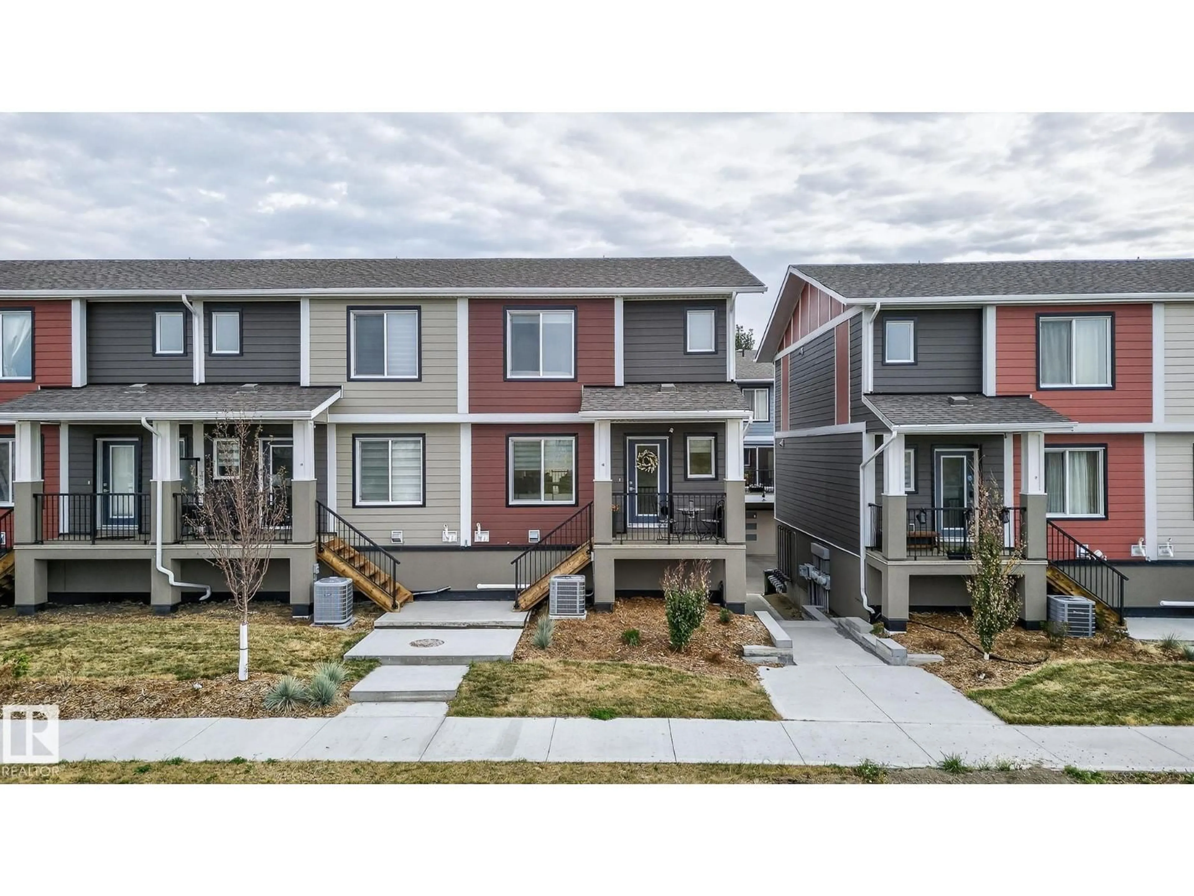 Home with vinyl exterior material, street for #16 - 9250 156 AV NW, Edmonton Alberta T5Z3N7