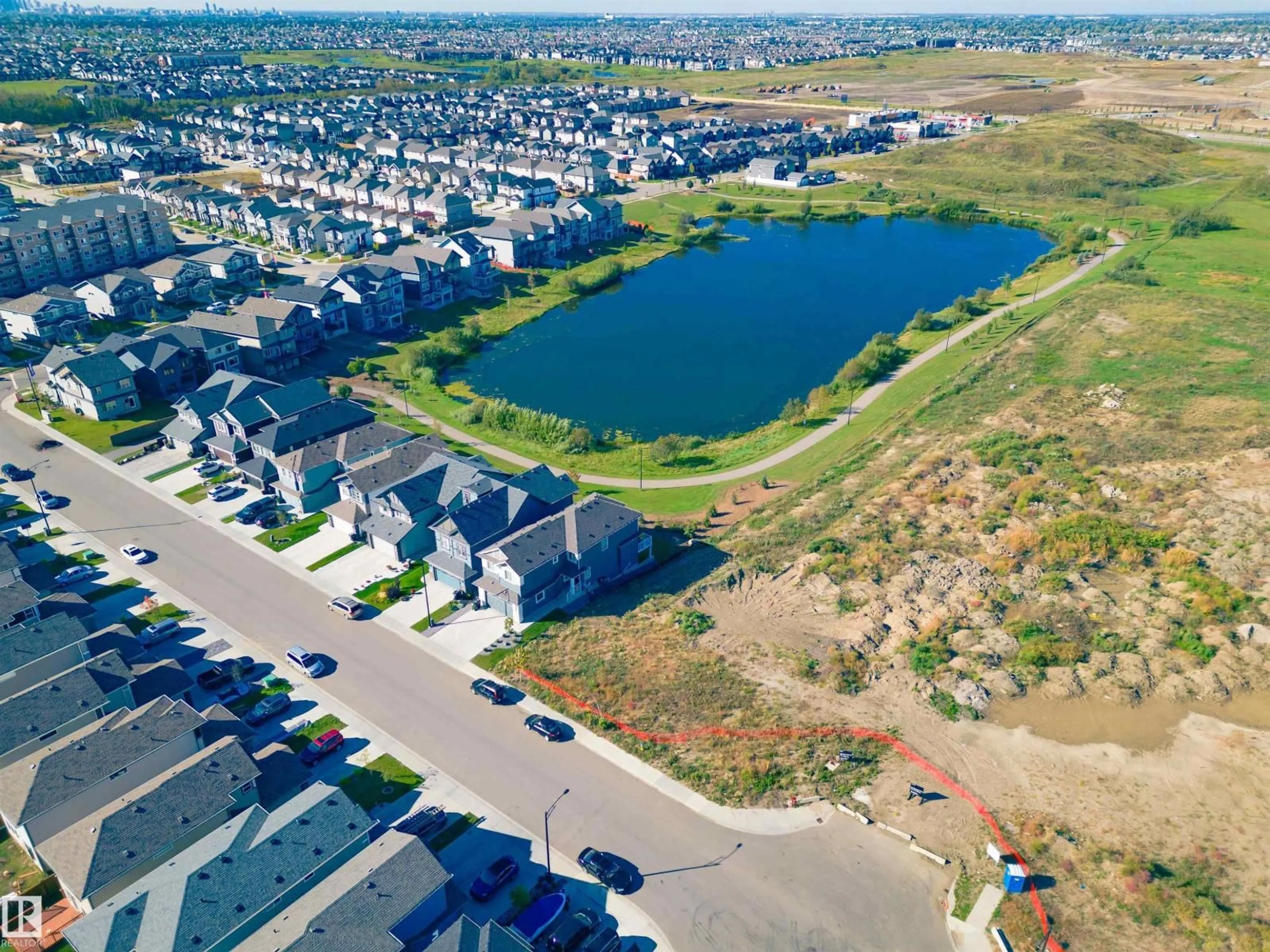 A pic from outside/outdoor area/front of a property/back of a property/a pic from drone, water/lake/river/ocean view for 6257 175A AV, Edmonton Alberta T5Y4A5