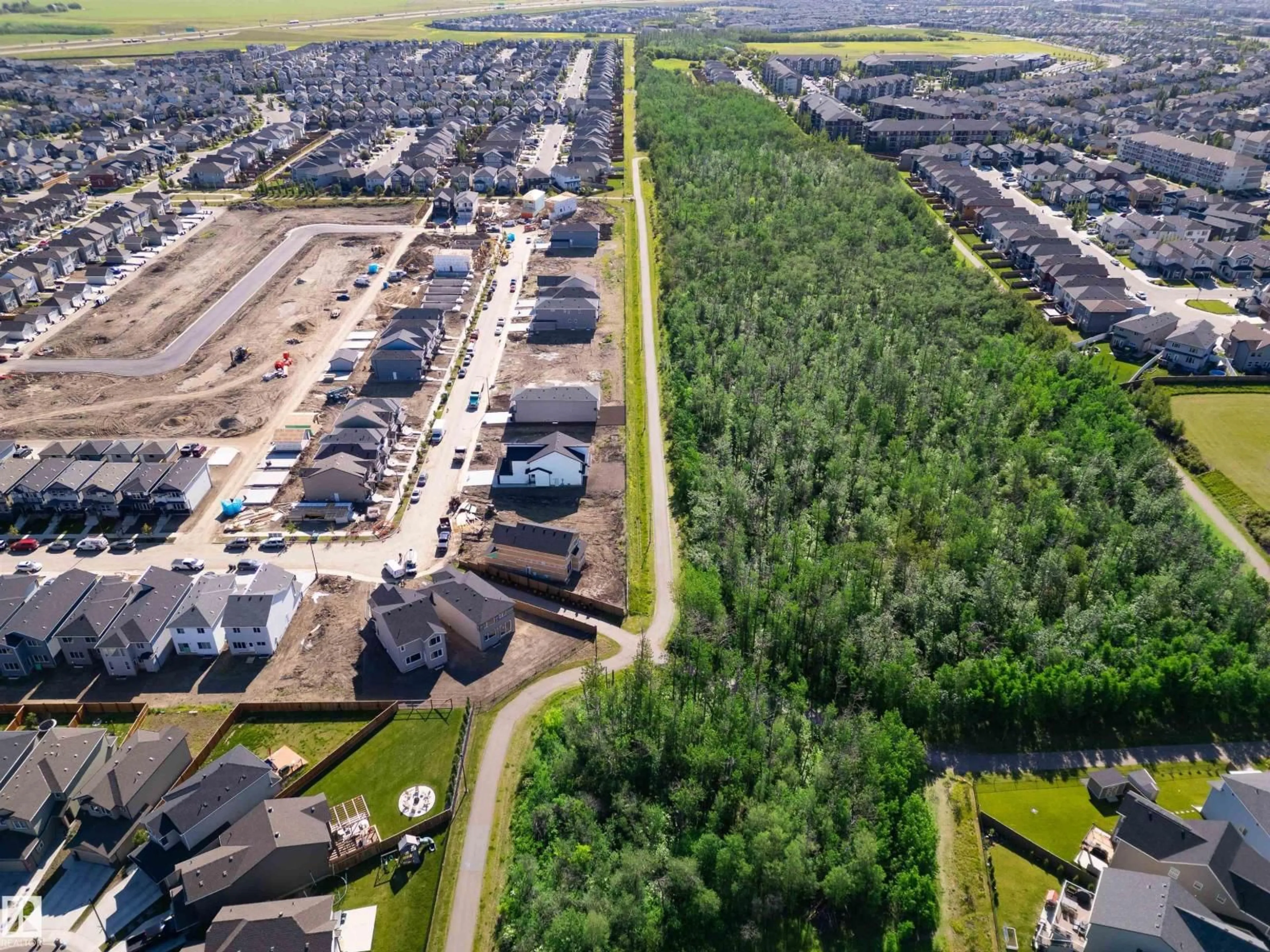 A pic from outside/outdoor area/front of a property/back of a property/a pic from drone, street for 6257 175A AV, Edmonton Alberta T5Y4A5
