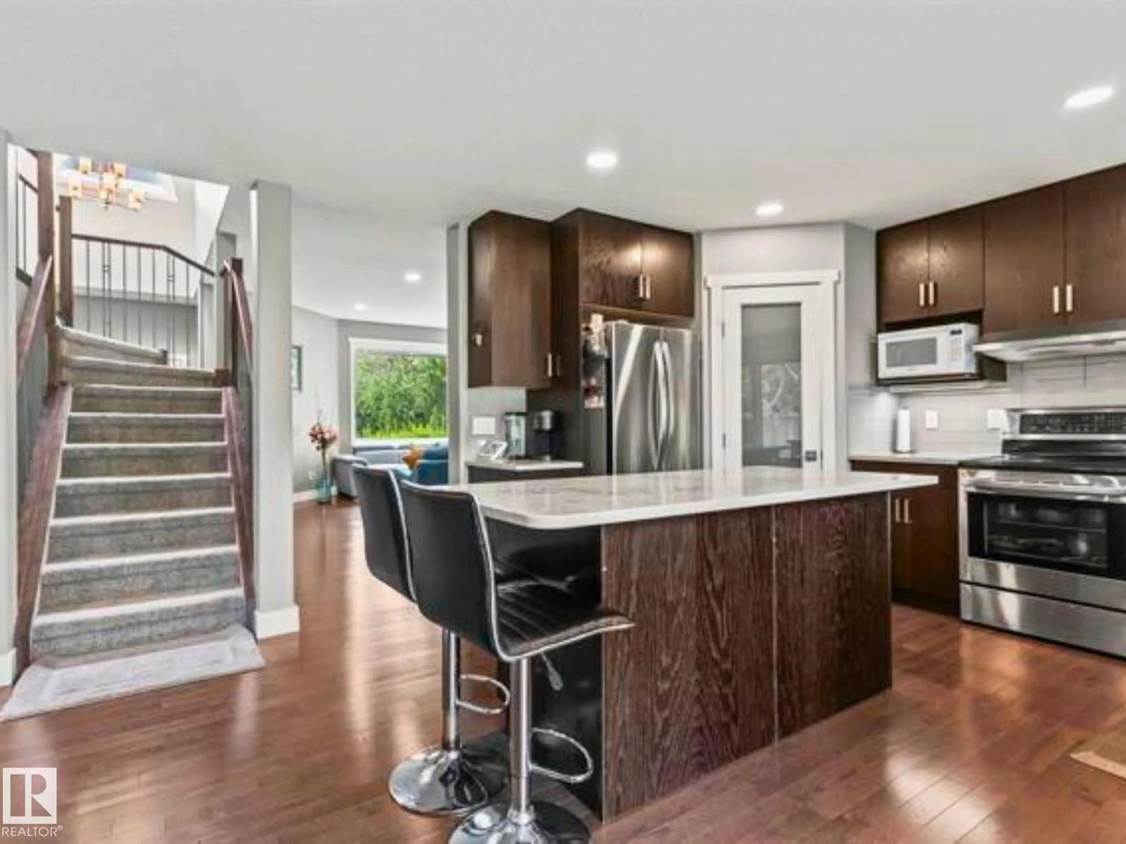 Open concept kitchen, wood/laminate floor for 3747 30 ST, Edmonton Alberta T6T1H7