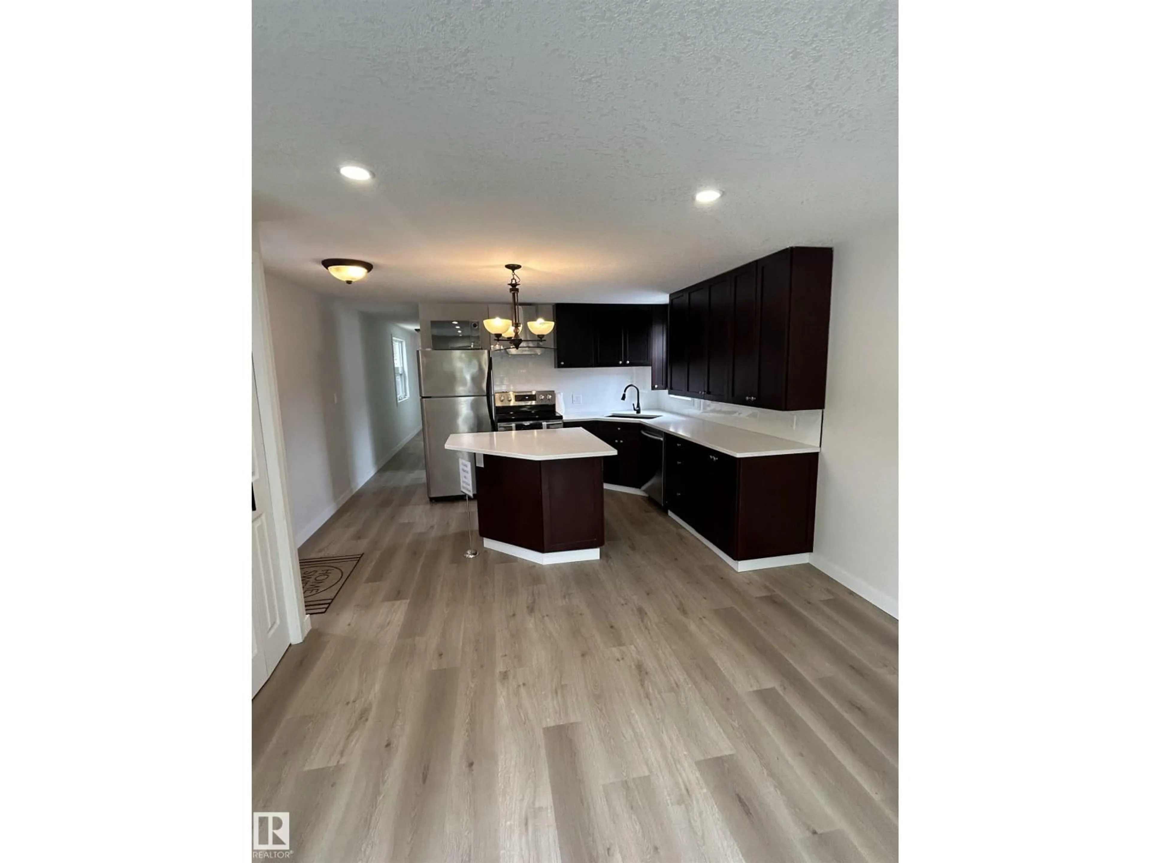 Open concept kitchen, wood/laminate floor for 714 WEST RIDGE PL, Edmonton Alberta T5S1T5
