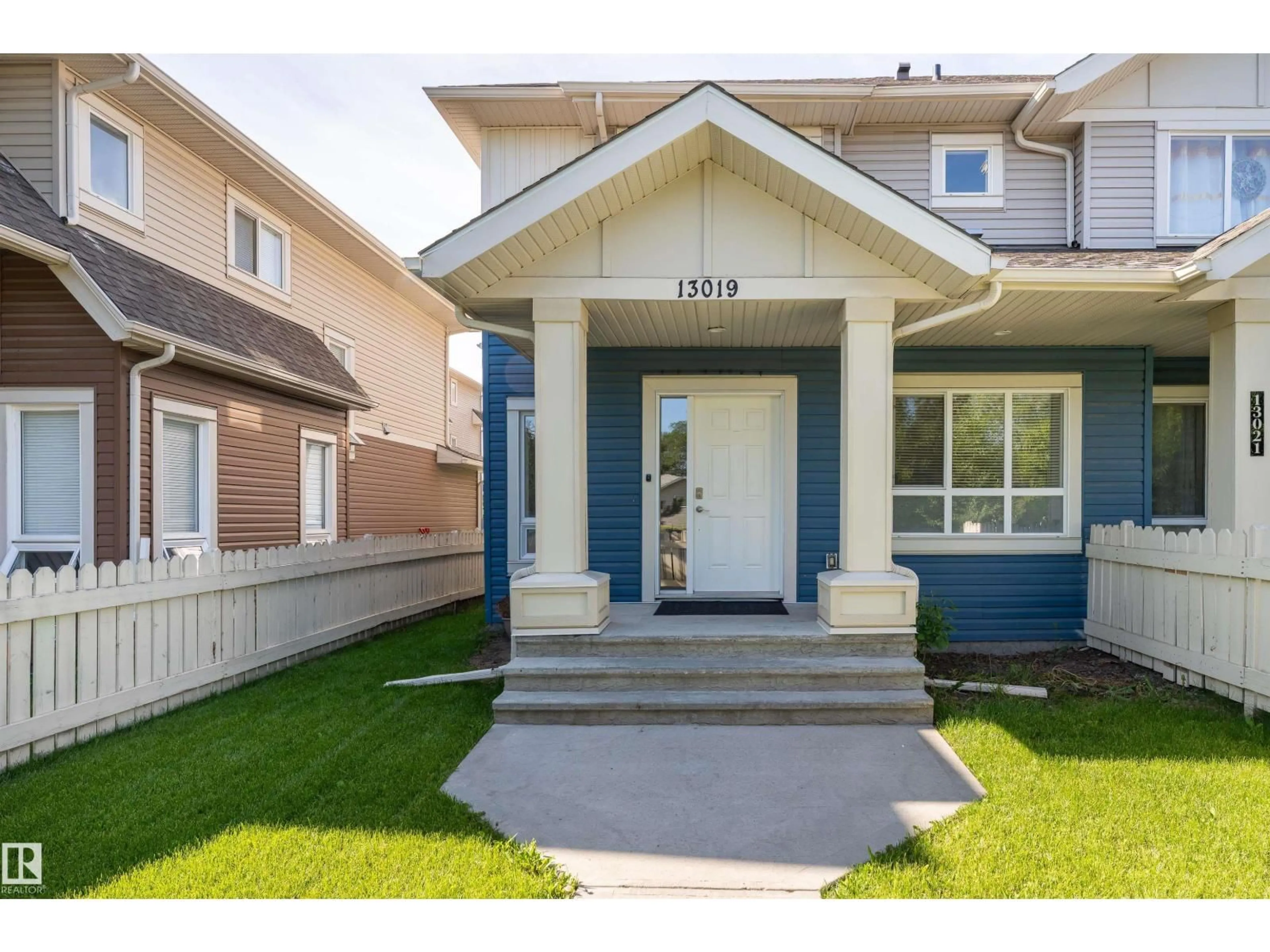 Home with vinyl exterior material, street for 13019 132 AV, Edmonton Alberta T5L3R2