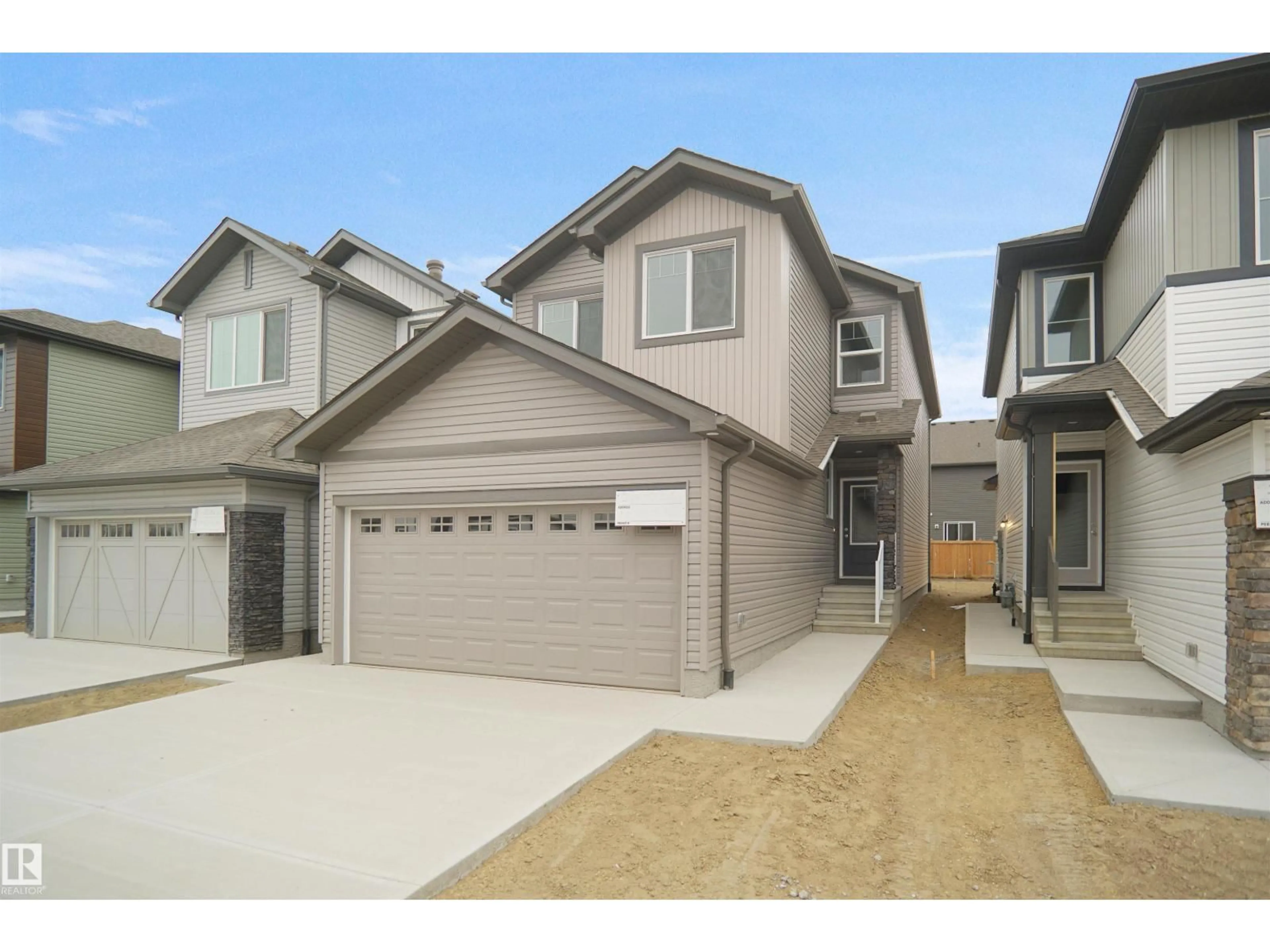 Home with vinyl exterior material, street for NW - 2017 209A ST, Edmonton Alberta T6M1P7