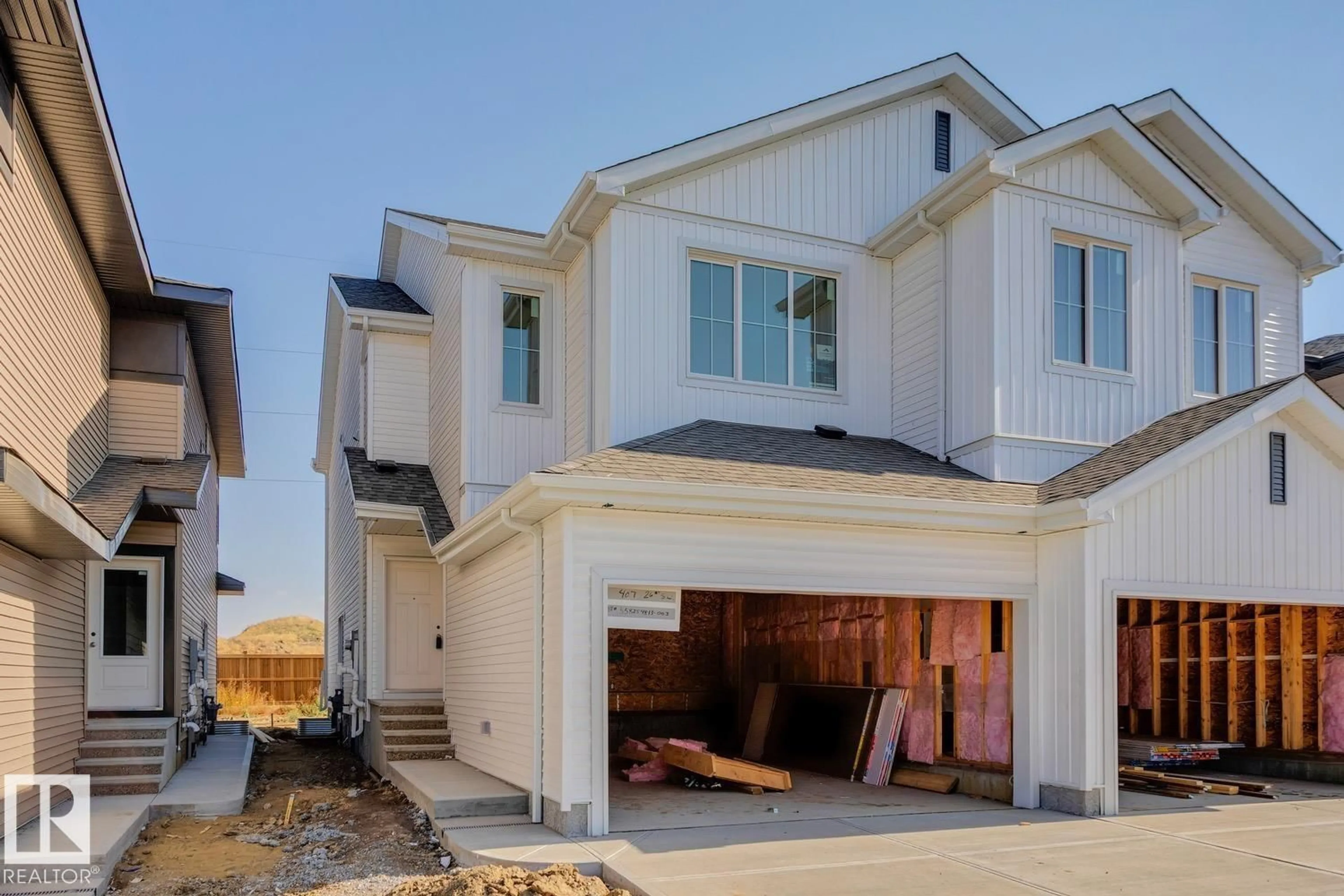 Home with vinyl exterior material, street for 407 26 ST, Edmonton Alberta T6X3E8