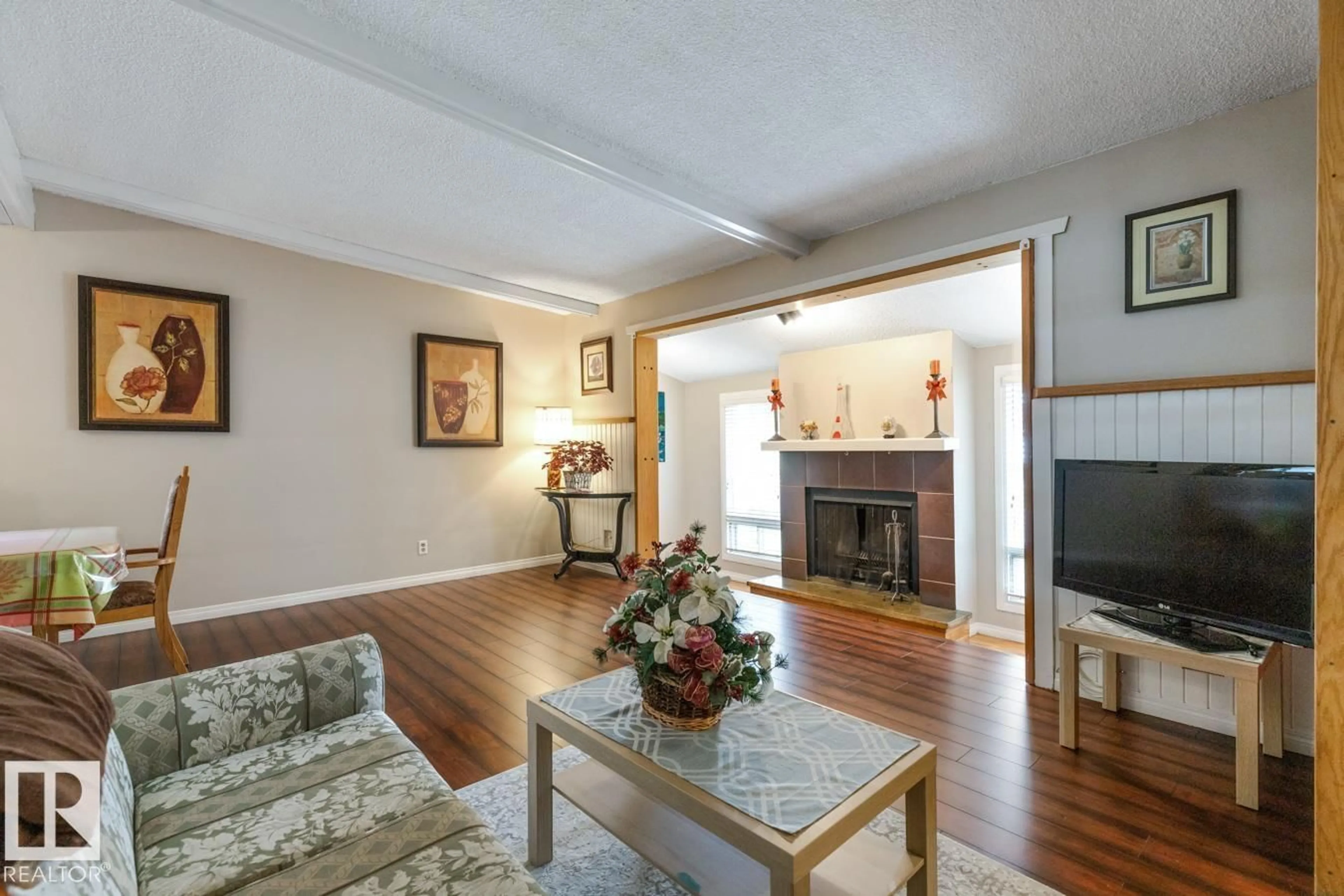 Living room with furniture, wood/laminate floor for 6303 89 AV, Edmonton Alberta T6B2G5