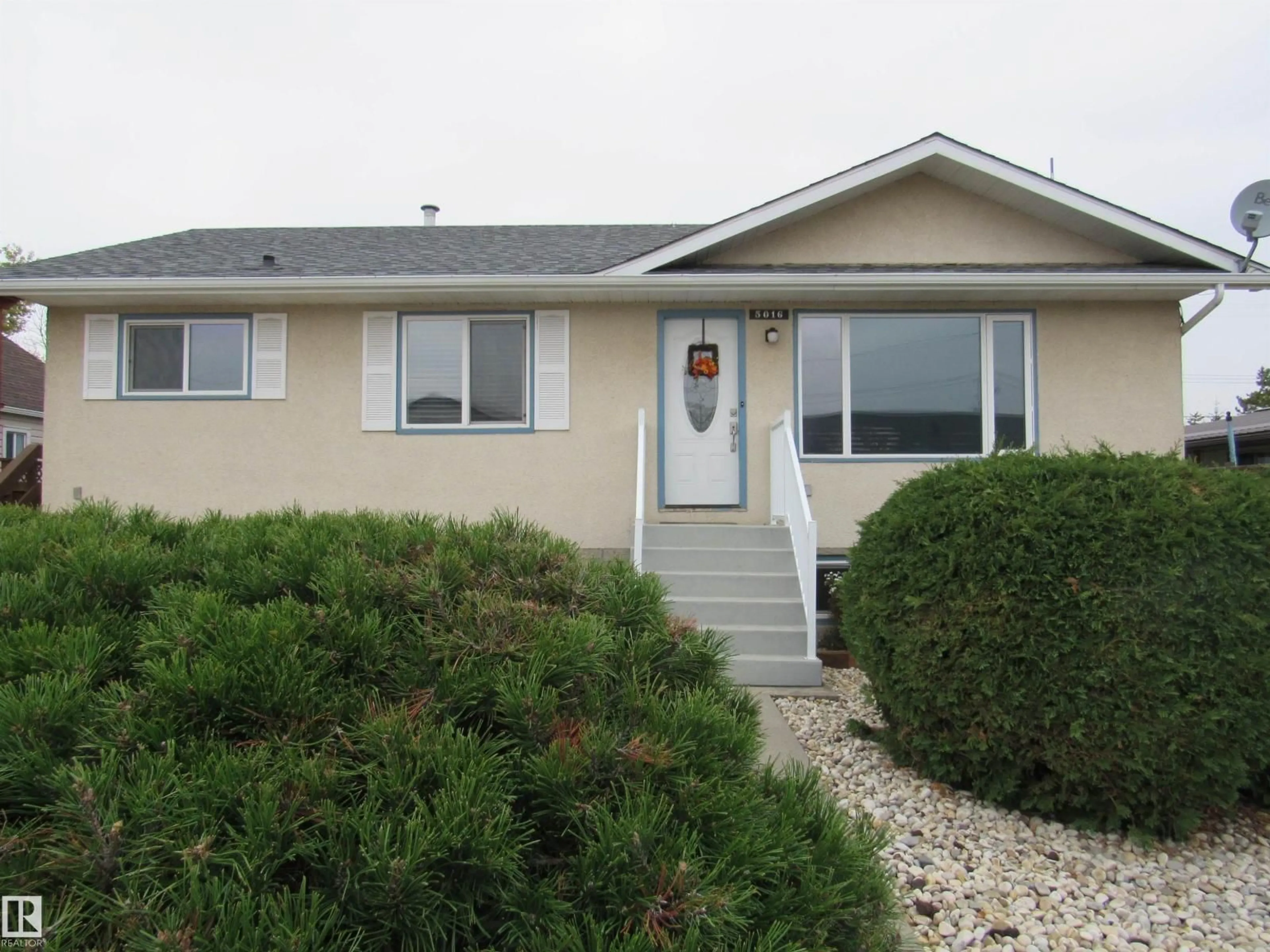 Home with vinyl exterior material, street for 5016 51 ST, Barrhead Alberta T7N1A1