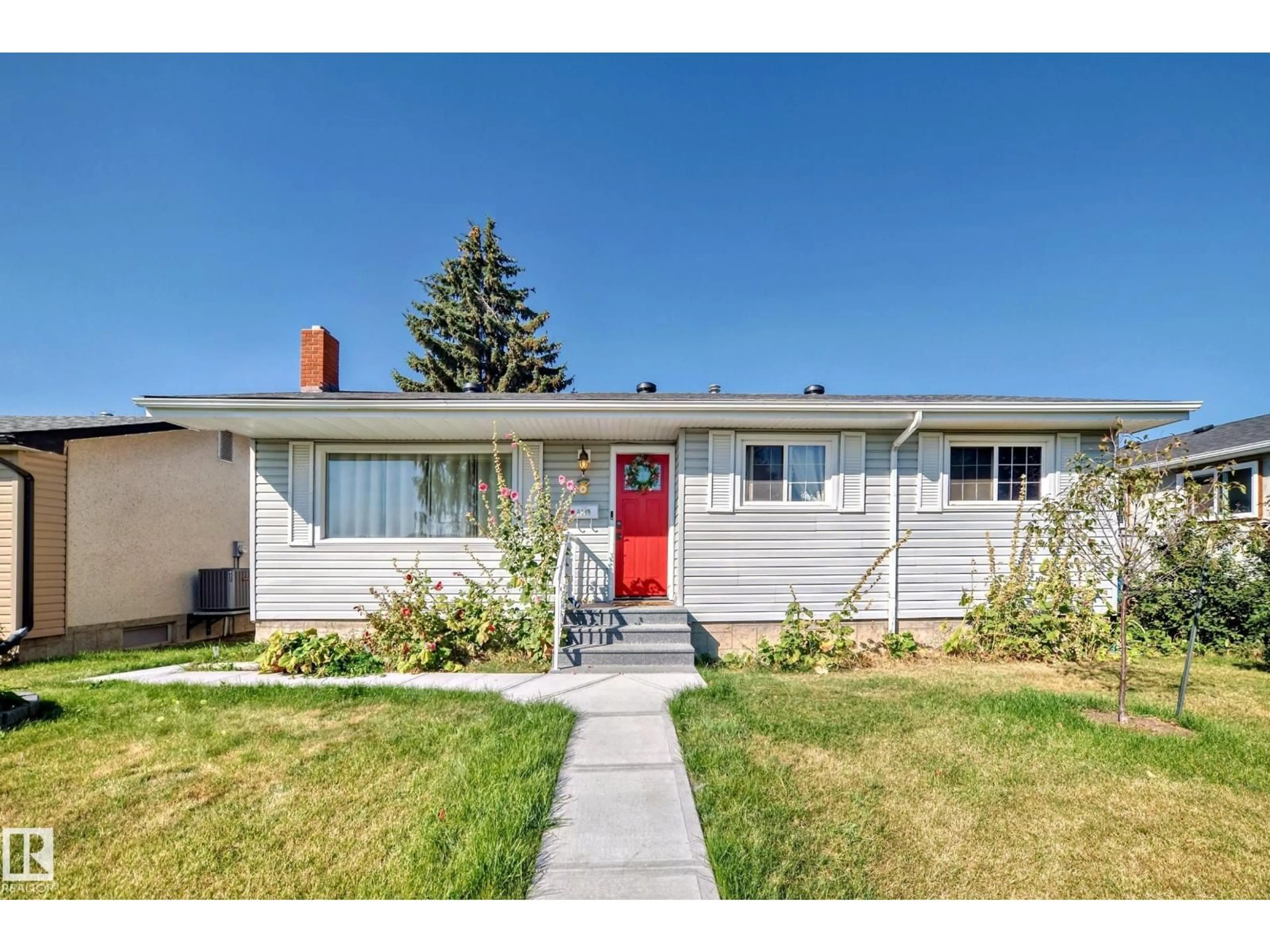 Home with vinyl exterior material, street for 6308 144A AV, Edmonton Alberta T5A1S4