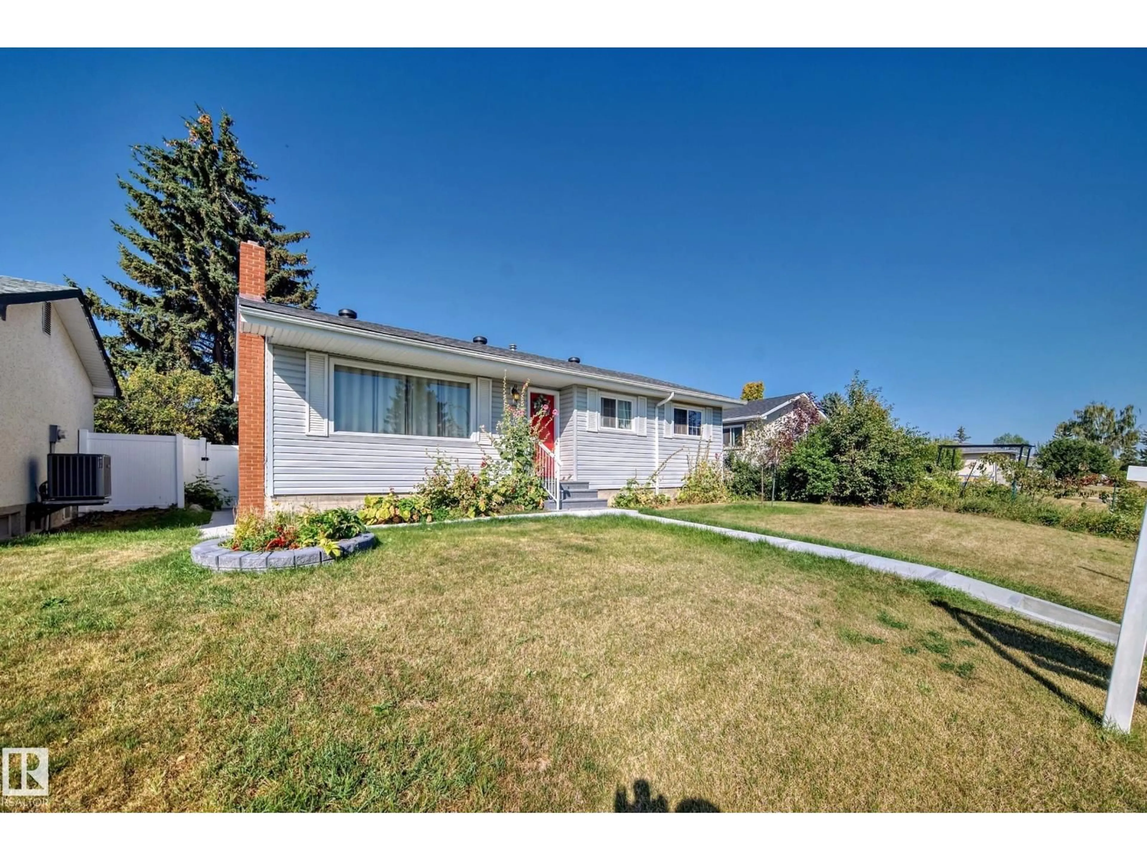 Home with vinyl exterior material, street for 6308 144A AV, Edmonton Alberta T5A1S4