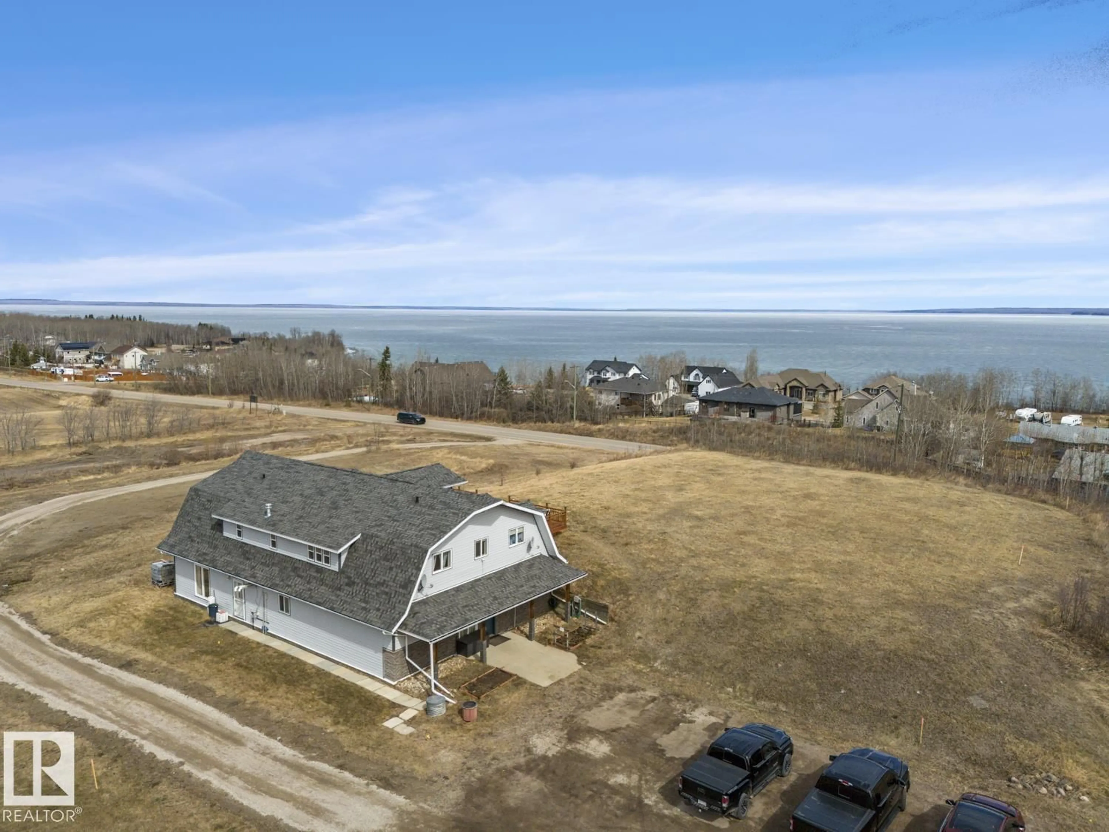 A pic from outside/outdoor area/front of a property/back of a property/a pic from drone, water/lake/river/ocean view for 1305 28 ST, Cold Lake Alberta T9M1G2