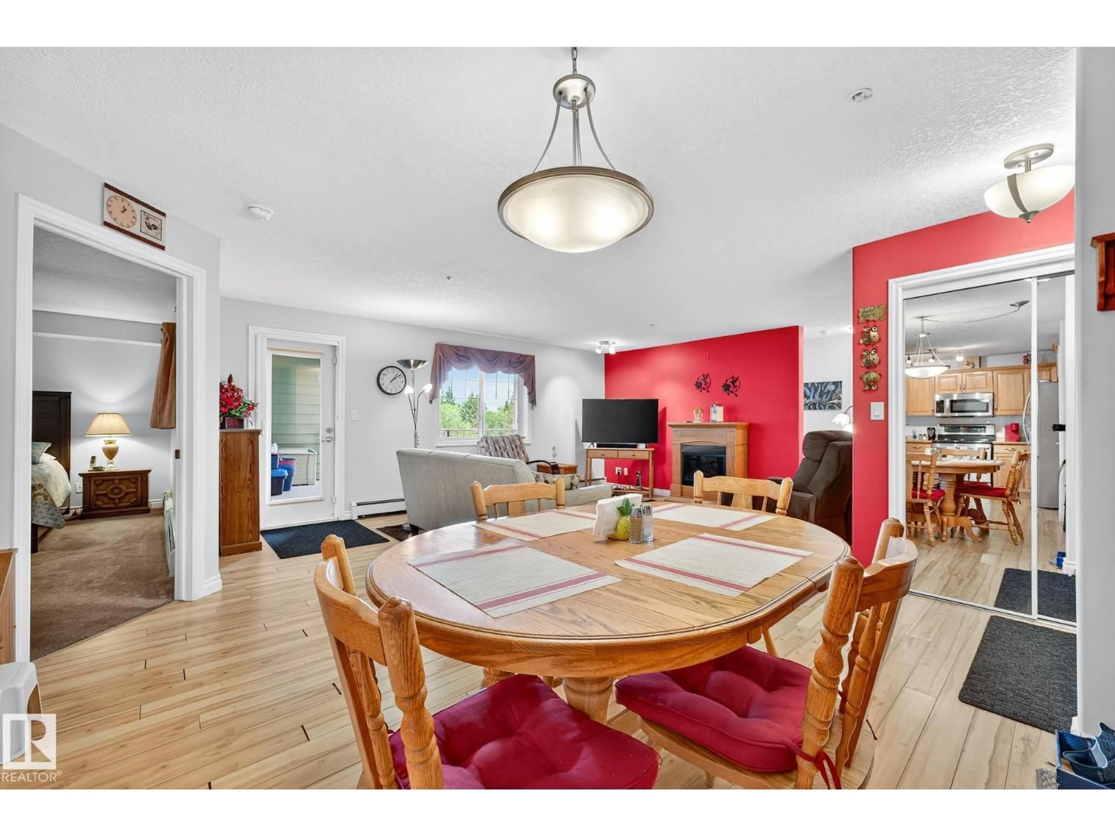 Dining room, wood/laminate floor for 202 - 9995 93 AV, Fort Saskatchewan Alberta T8L1N5