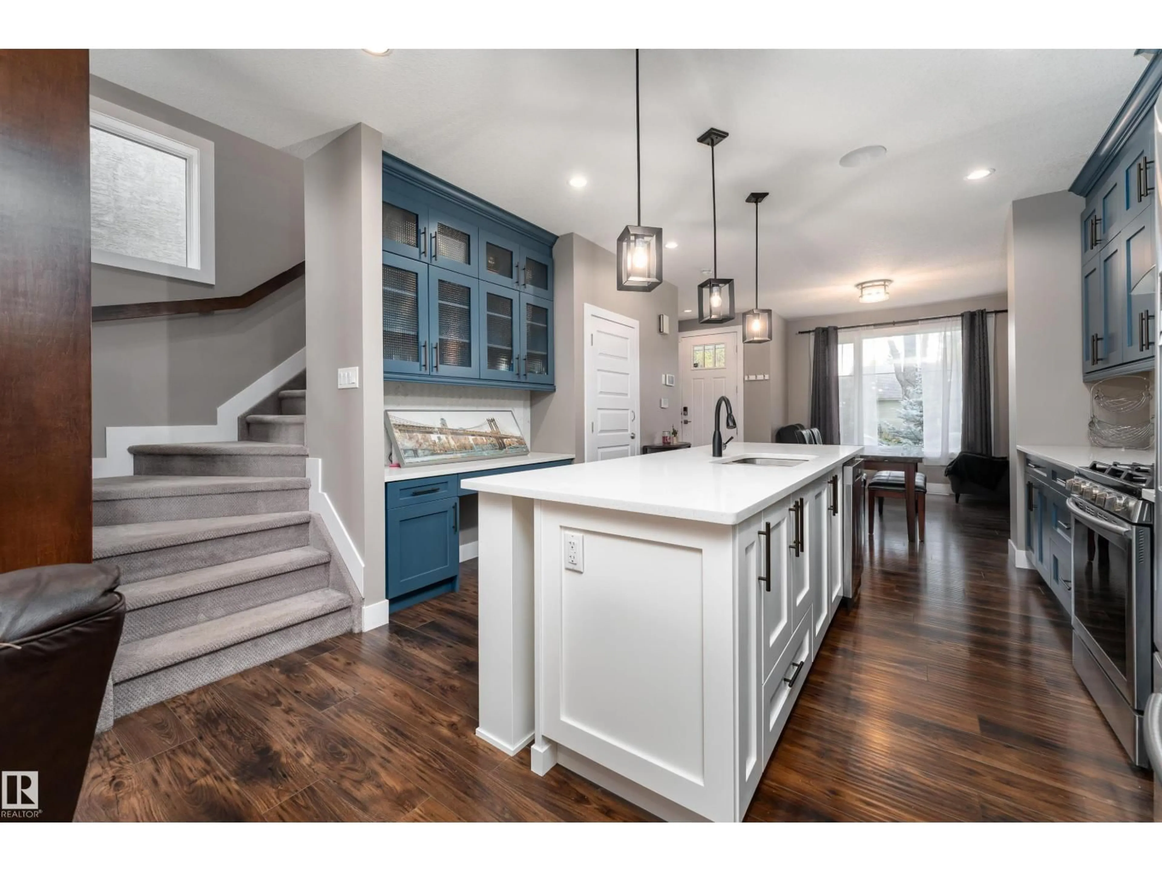 Open concept kitchen, wood/laminate floor for NW - 10706 67 AV, Edmonton Alberta T6H1Z9