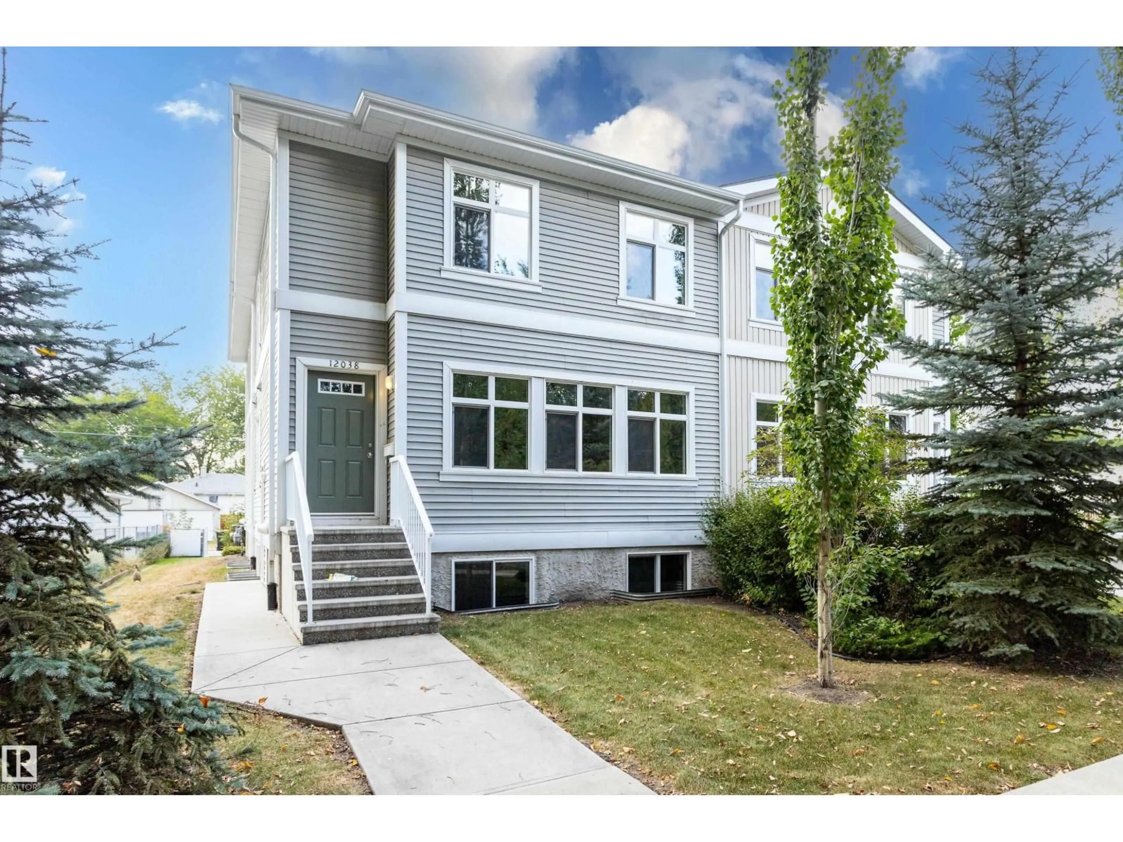 Home with vinyl exterior material, street for NW - 12038 62 ST, Edmonton Alberta T5W4C8
