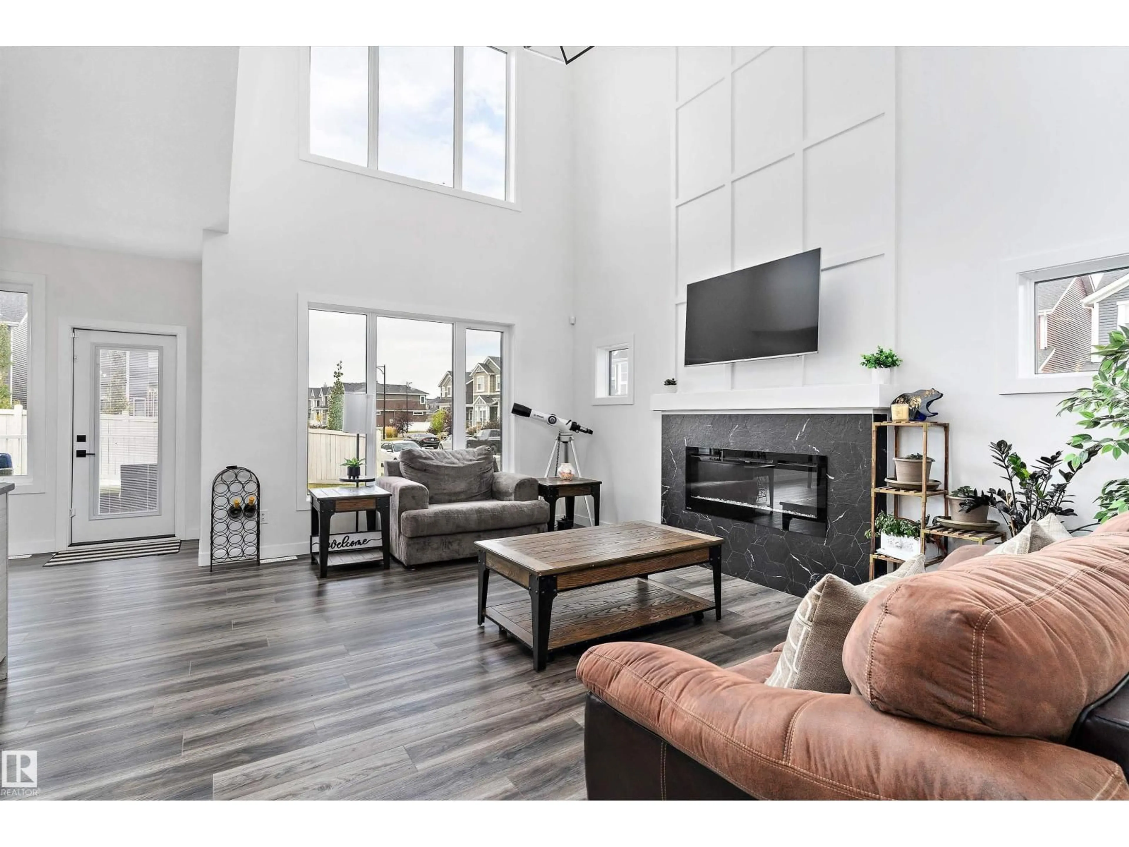 Living room with furniture, wood/laminate floor for 560 STOUT BN, Leduc Alberta T9E1K3