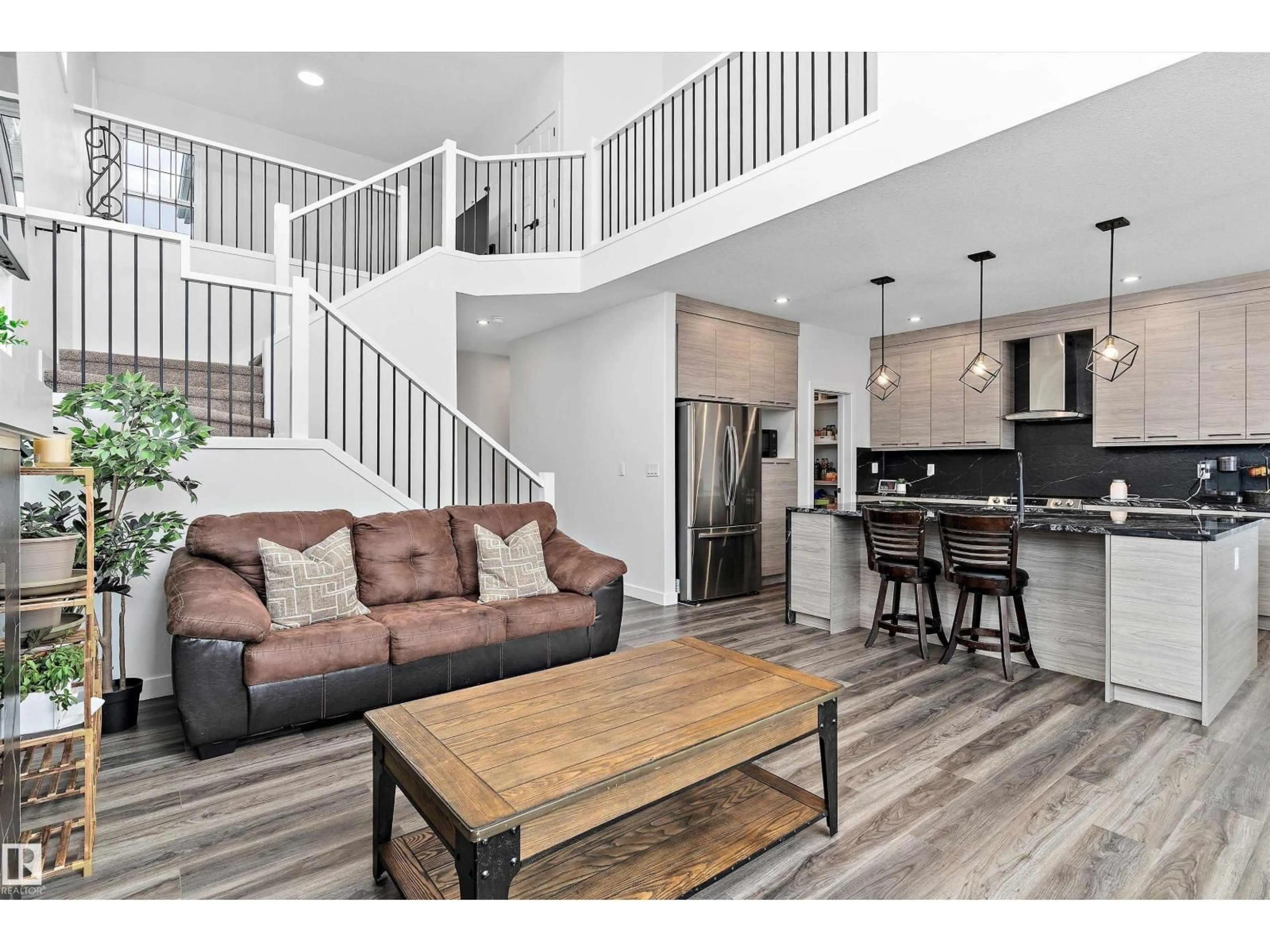 Open concept kitchen, wood/laminate floor for 560 STOUT BN, Leduc Alberta T9E1K3