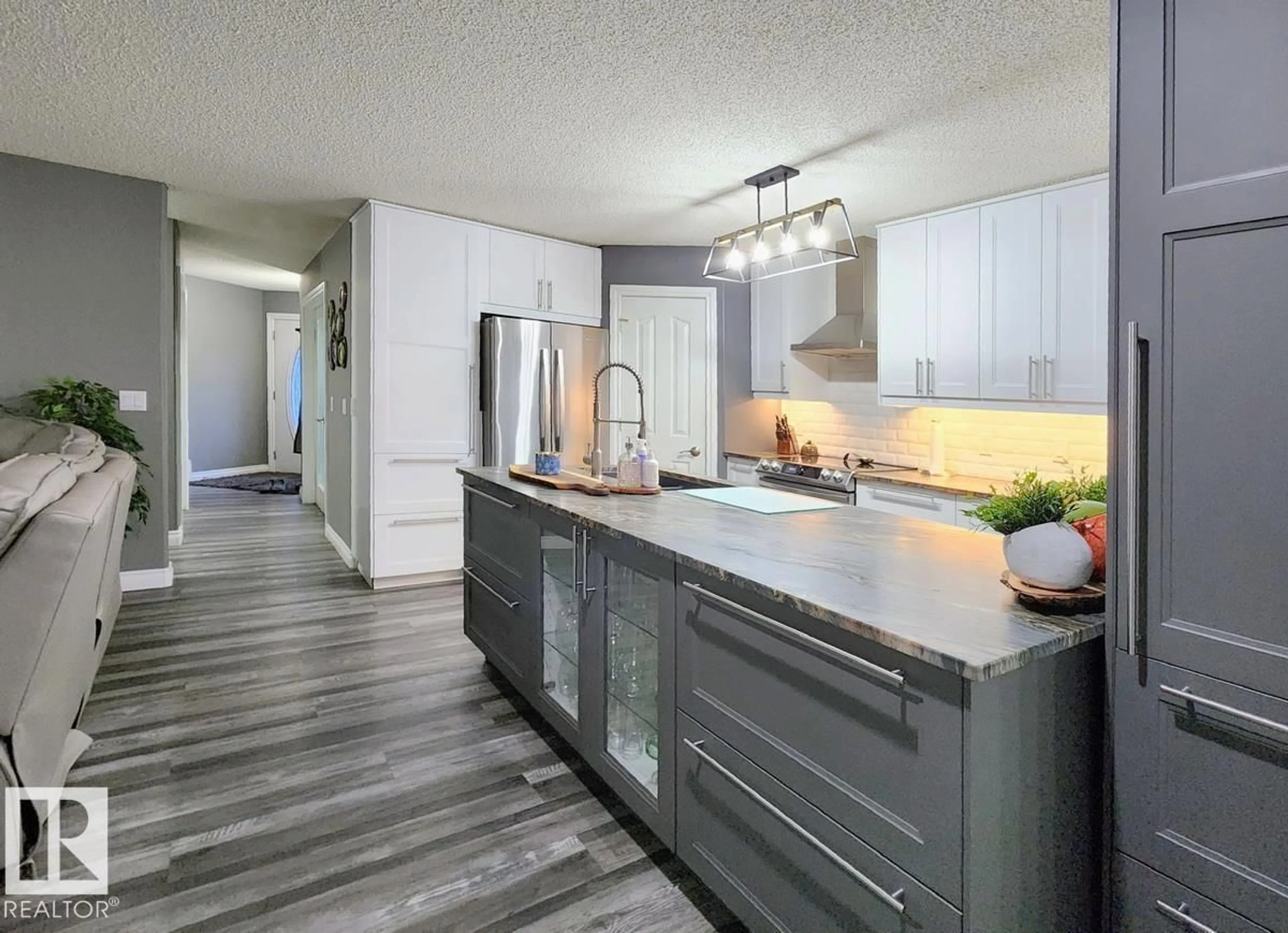 Open concept kitchen, wood/laminate floor for 31 WESTWOOD WY, Fort Saskatchewan Alberta T8L4G4