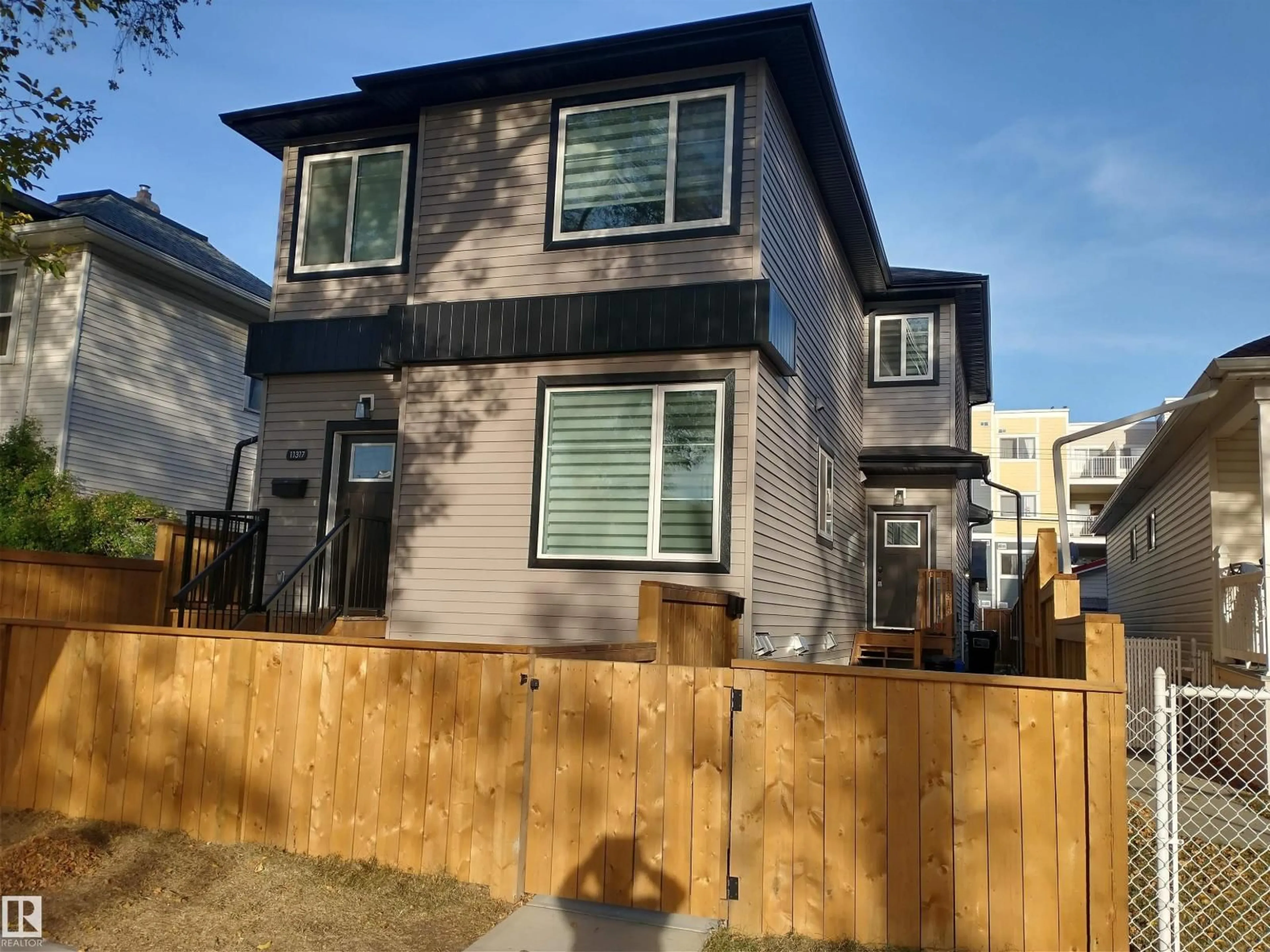 Home with vinyl exterior material, street for 11315 95A ST NW, Edmonton Alberta T5G1P2