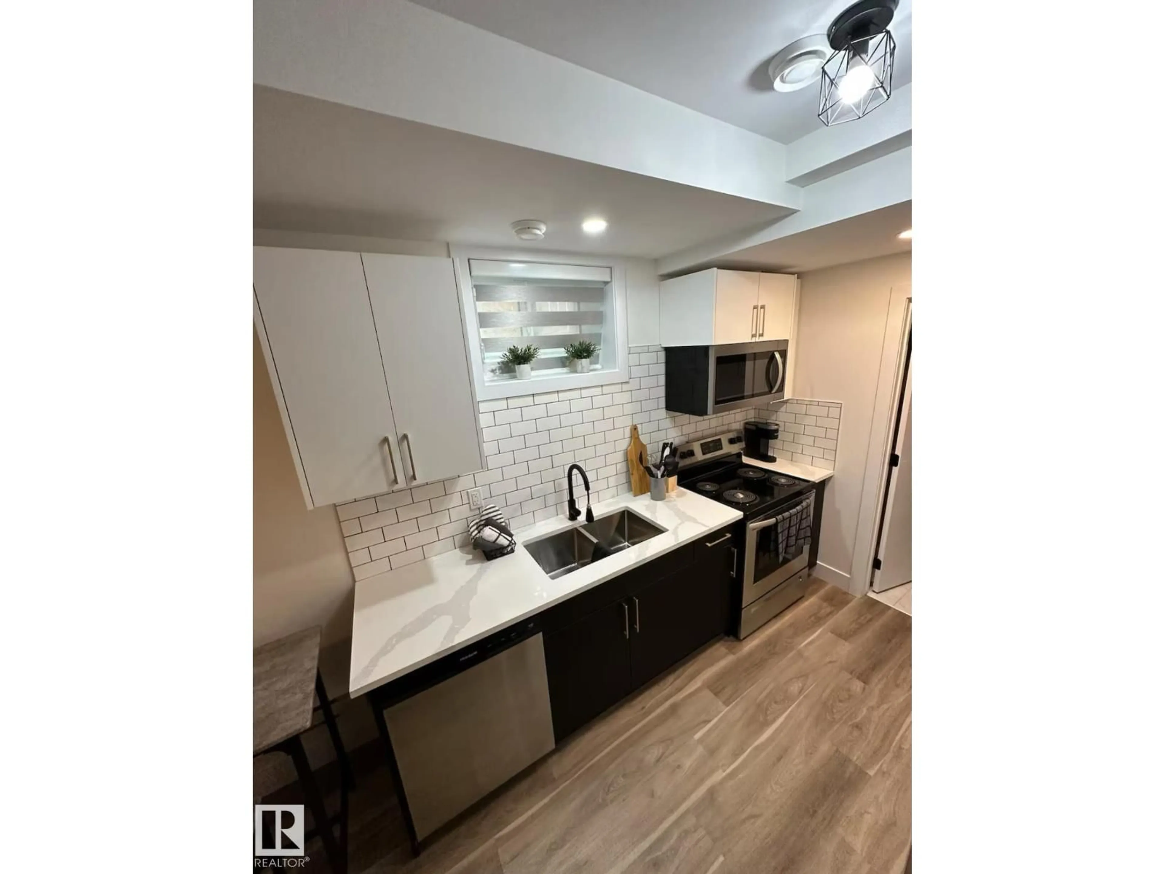 Open concept kitchen, ceramic/tile floor for 11315 95A ST NW, Edmonton Alberta T5G1P2
