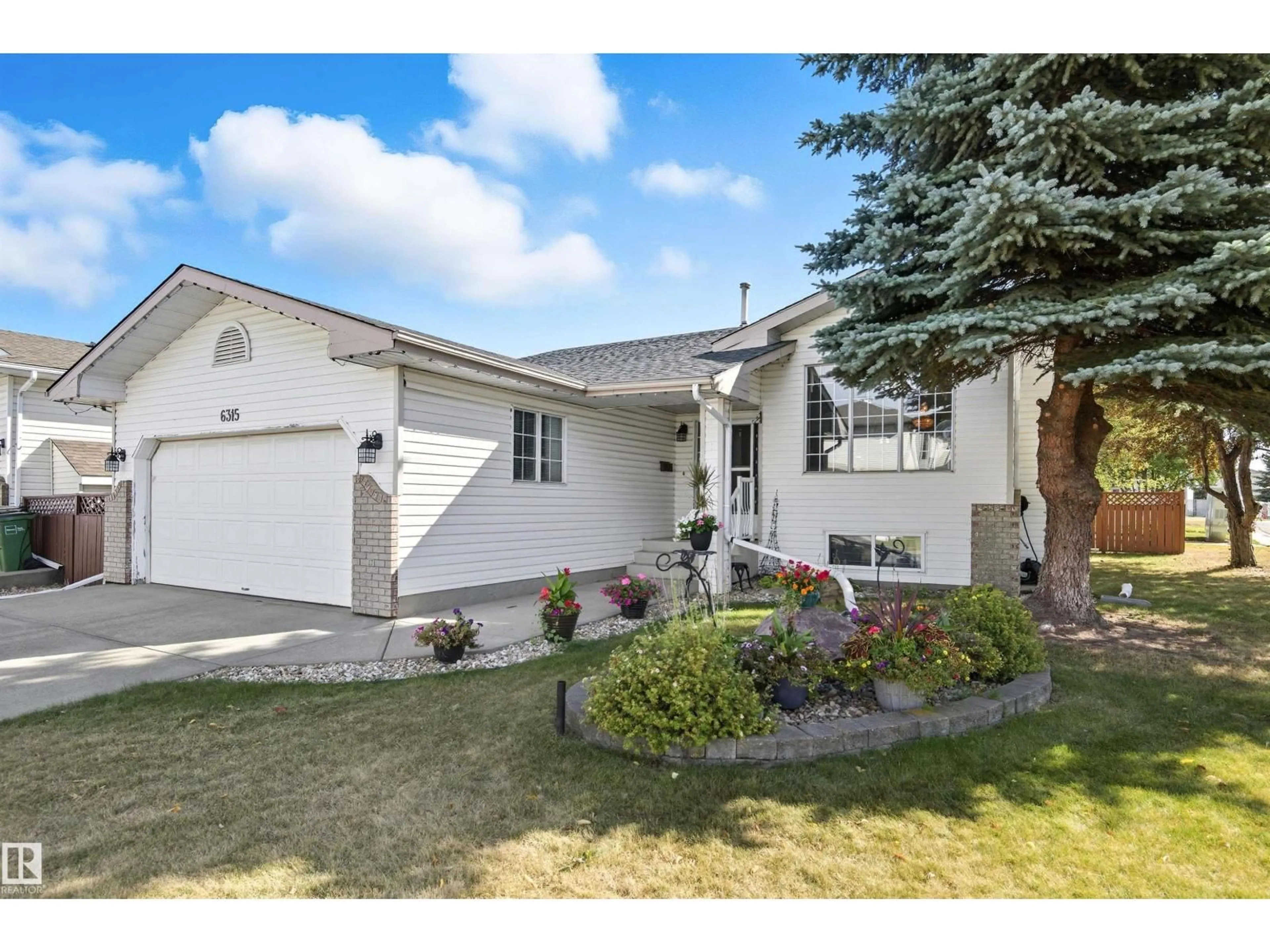 Home with vinyl exterior material, street for 6315 162 AV, Edmonton Alberta T5Y2R1