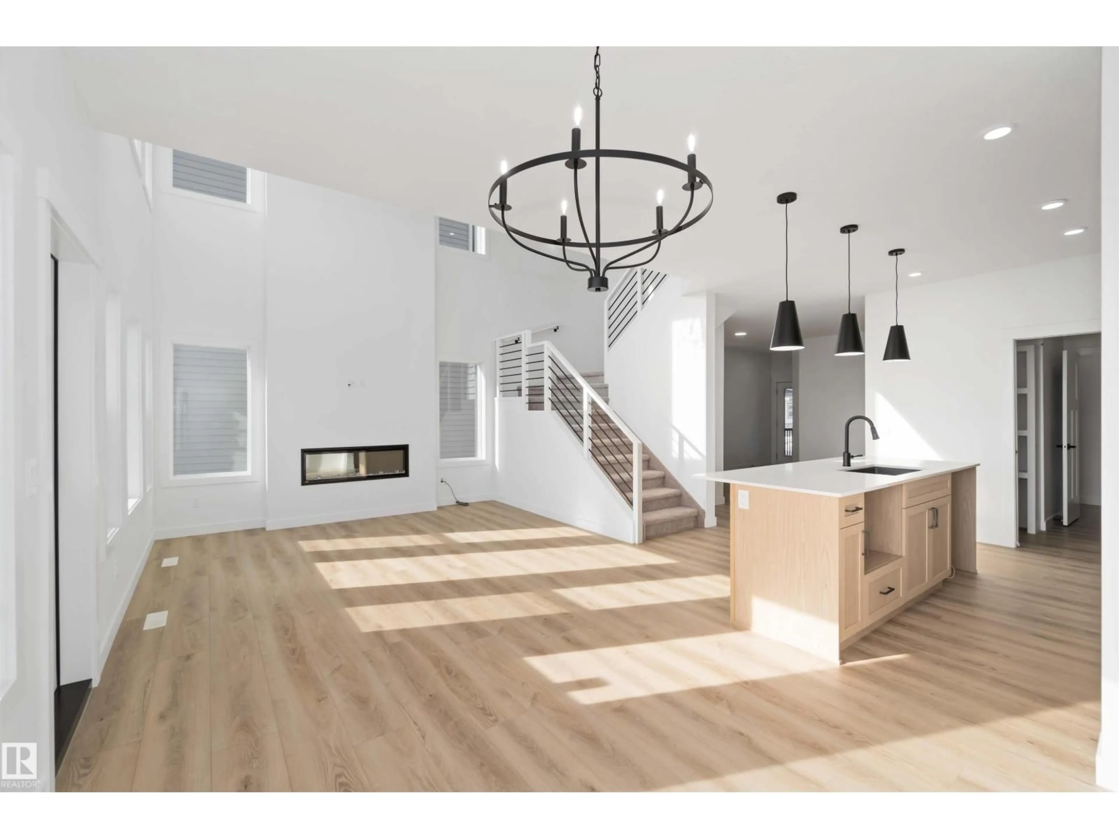 Open concept kitchen, wood/laminate floor for 1603 12 ST, Edmonton Alberta T6T0S9