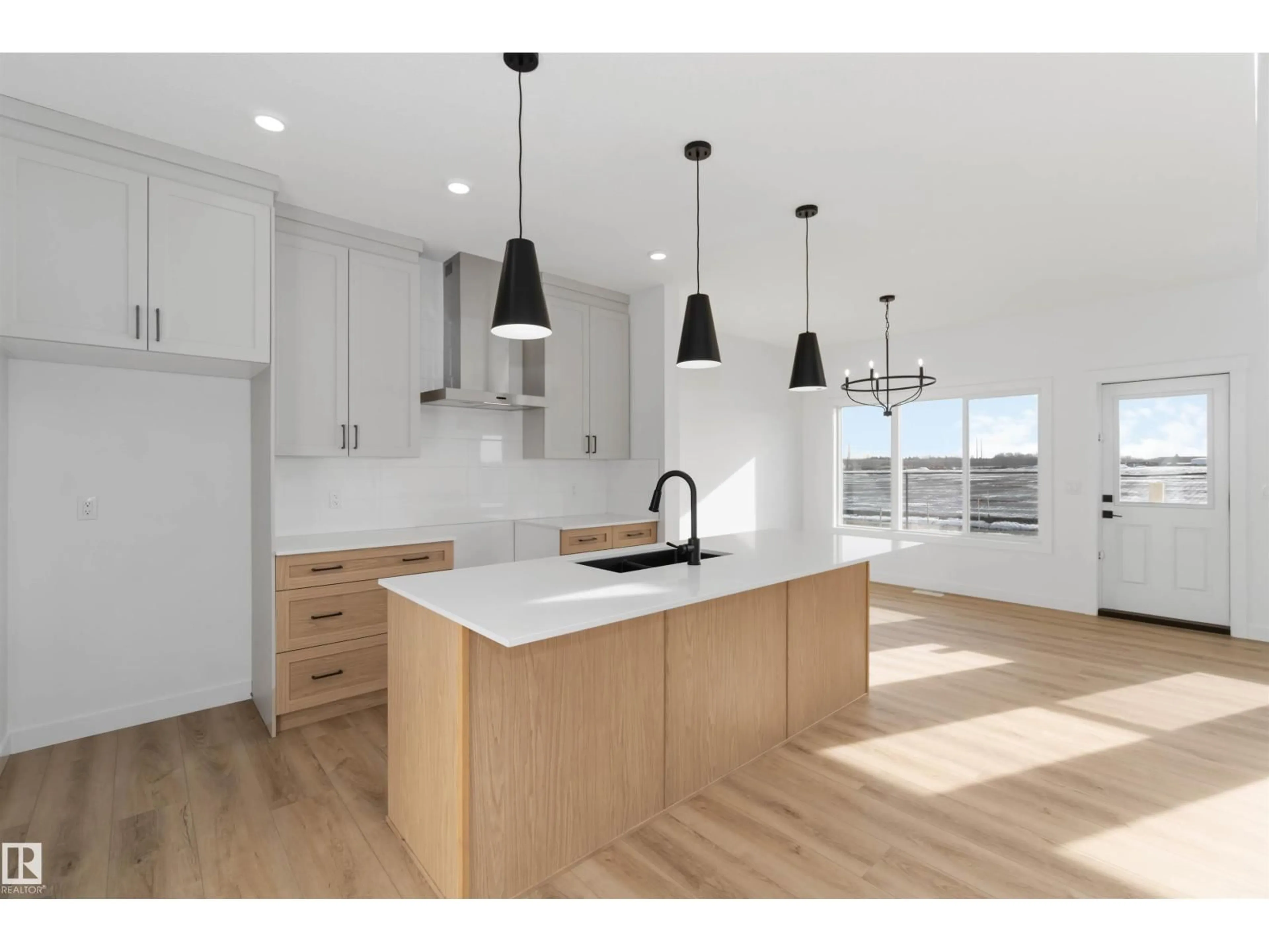 Open concept kitchen, wood/laminate floor for 1603 12 ST, Edmonton Alberta T6T0S9