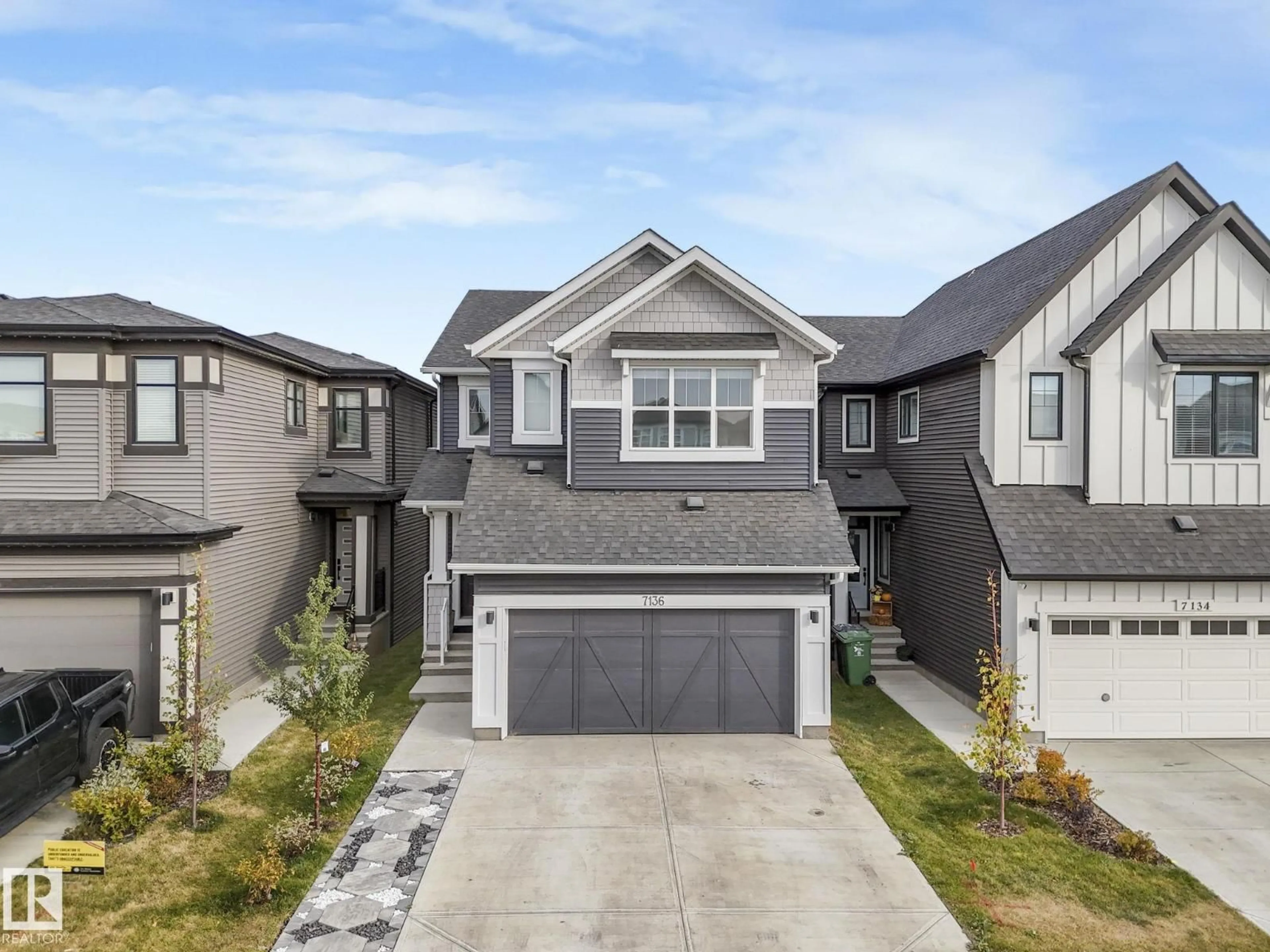 Home with vinyl exterior material, street for 7136 52 AV, Beaumont Alberta T4X2Z8