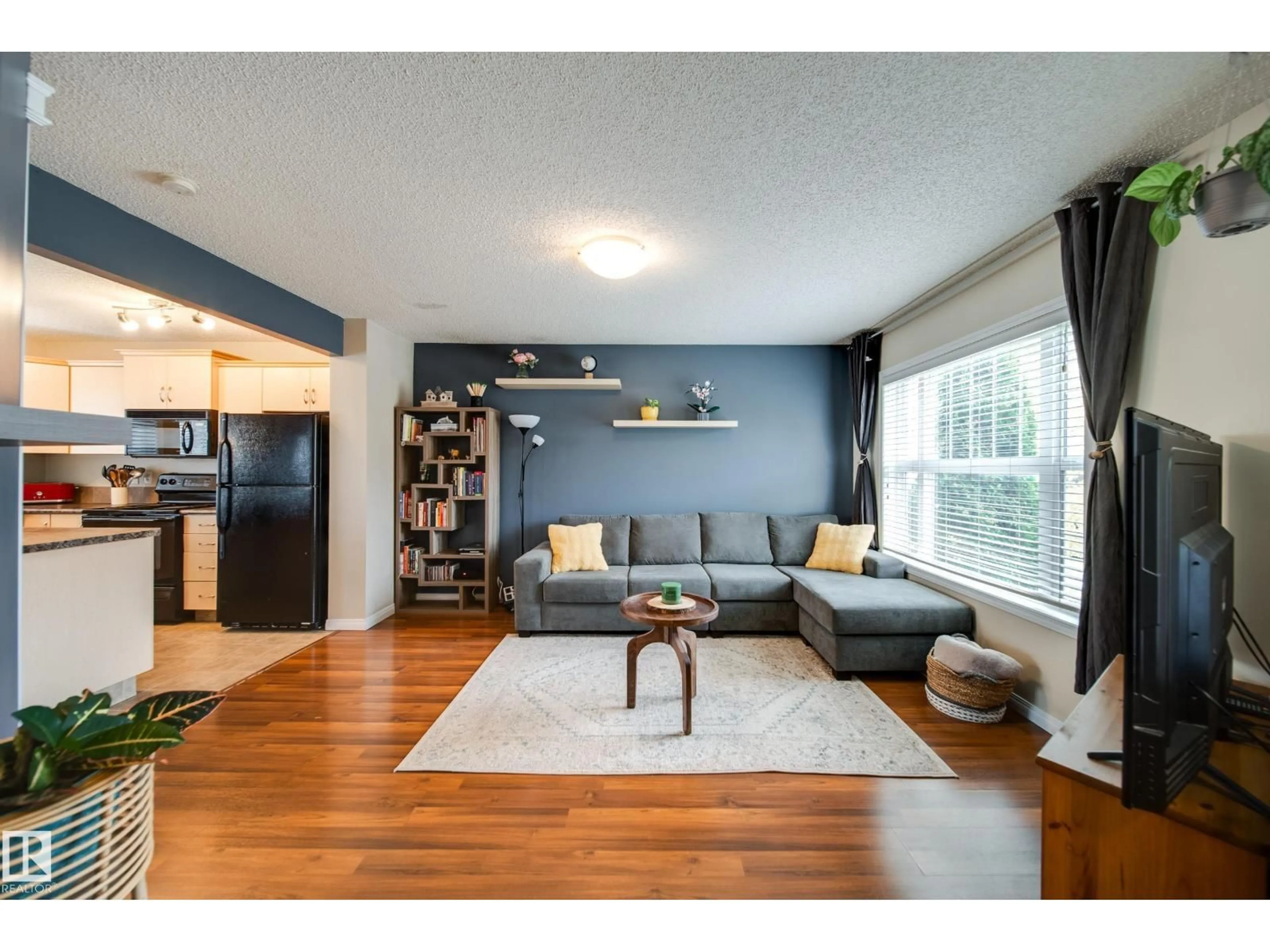 Living room with furniture, wood/laminate floor for 14823 140 ST, Edmonton Alberta T6V0A9