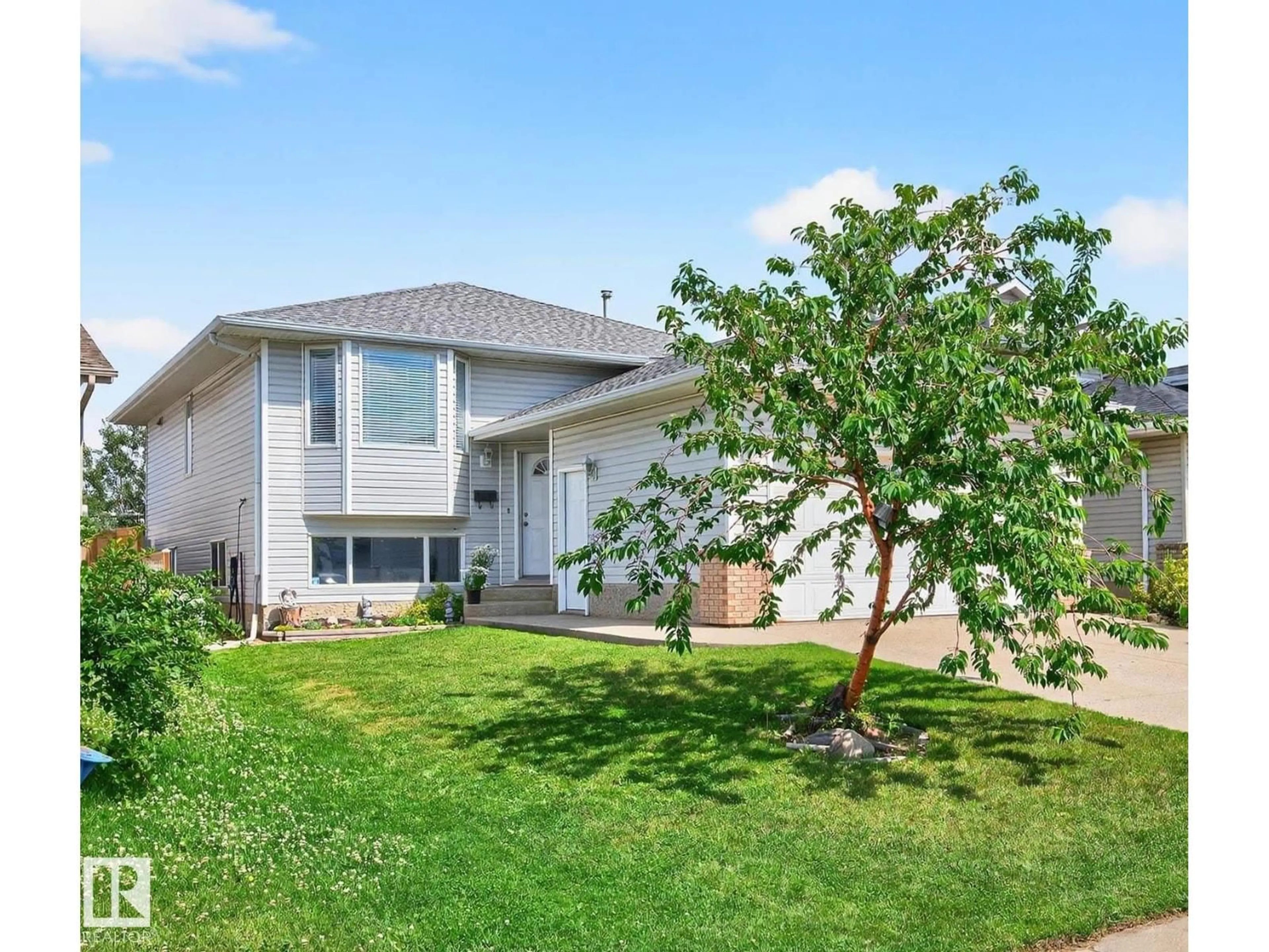 Home with vinyl exterior material, street for 1079 JONES CR, Edmonton Alberta T6L6Y1