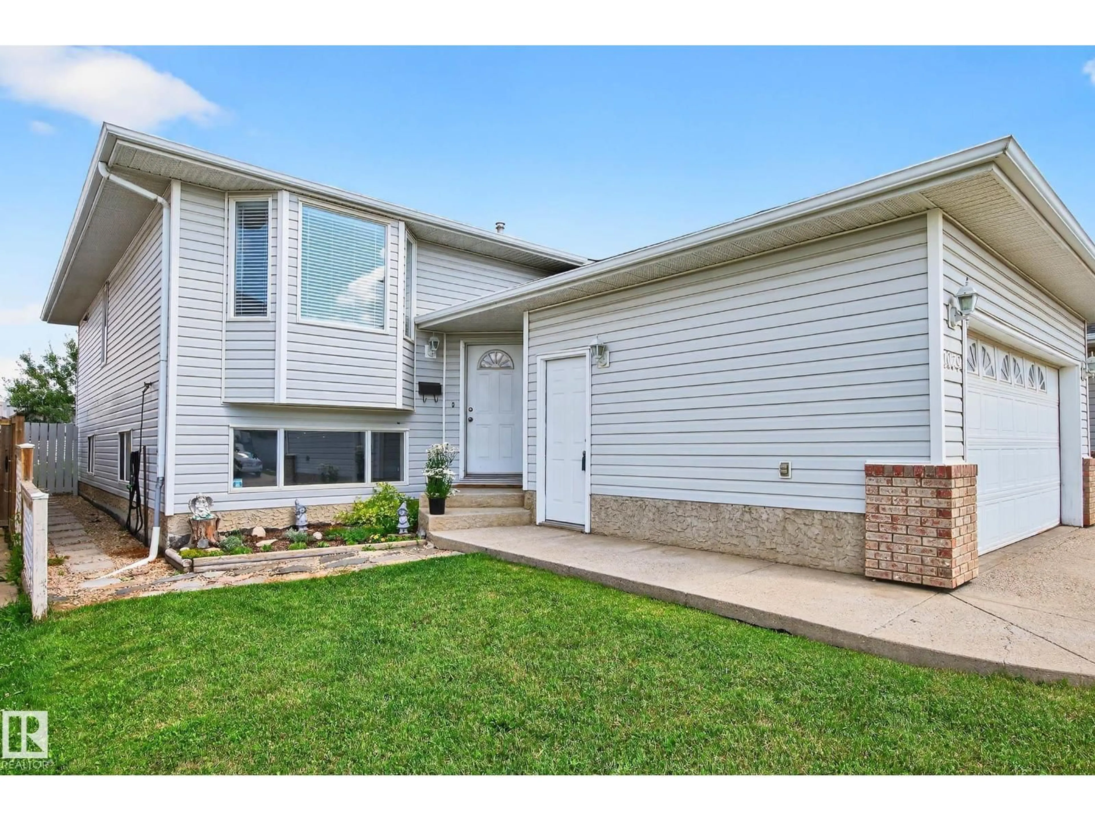 Home with vinyl exterior material, street for 1079 JONES CR, Edmonton Alberta T6L6Y1