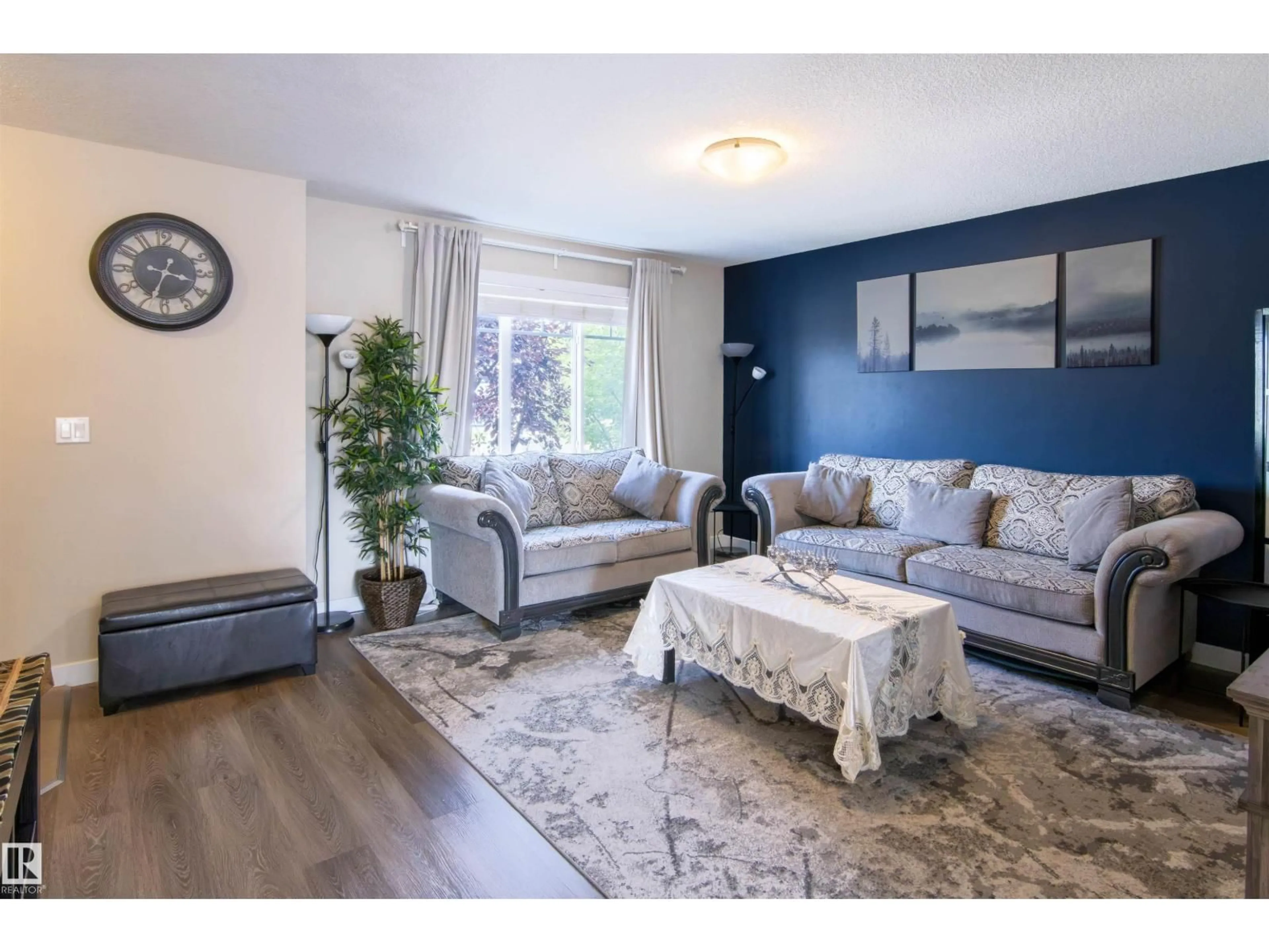 Living room with furniture, wood/laminate floor for NW - 13810 166 AV, Edmonton Alberta T6V0K4