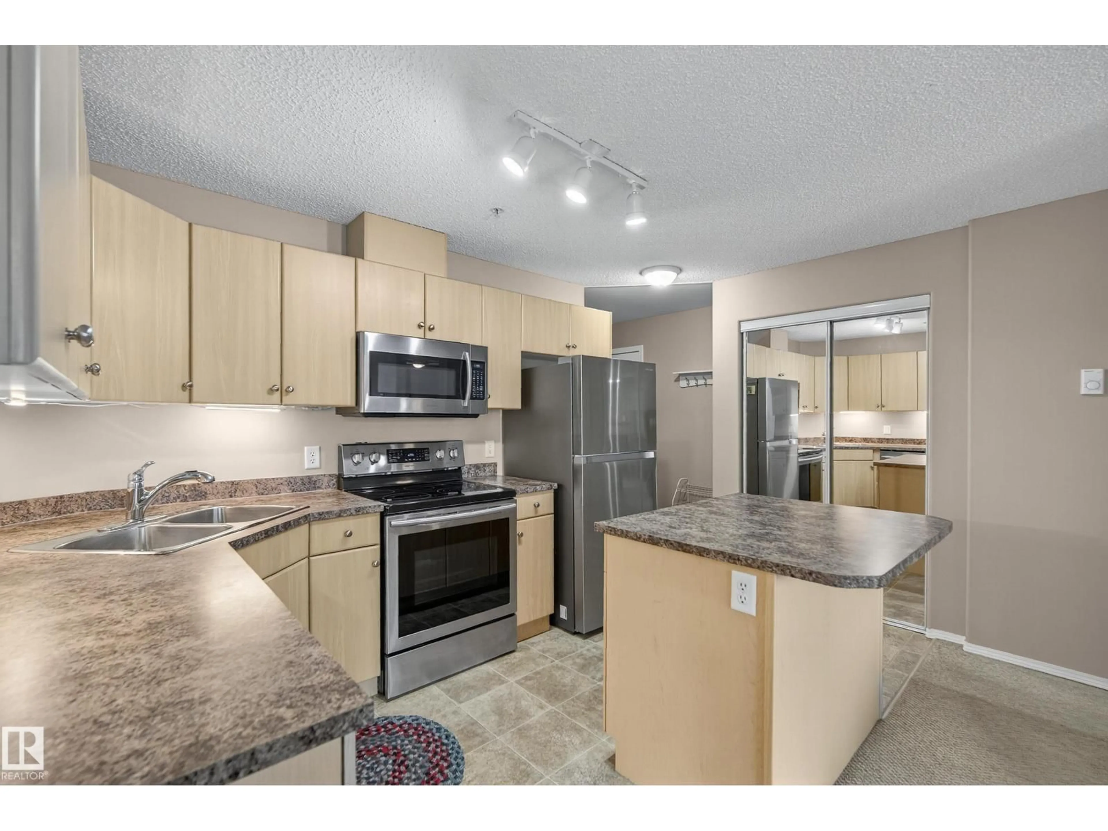 Open concept kitchen, unknown for 227 16303 95 ST NW, Edmonton Alberta T5Z3V1