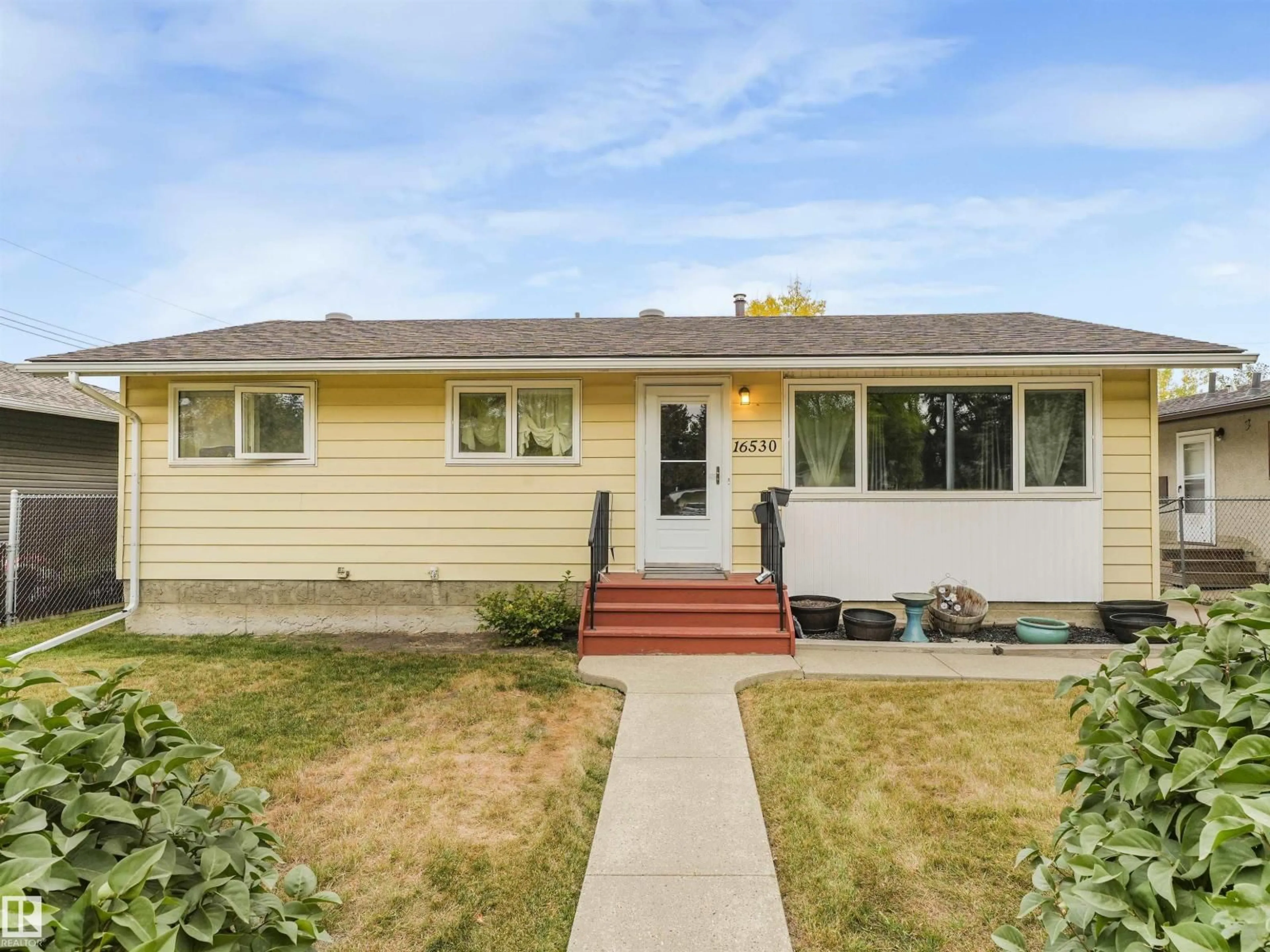 Home with vinyl exterior material, street for 16530 104 AV, Edmonton Alberta T5P0S7