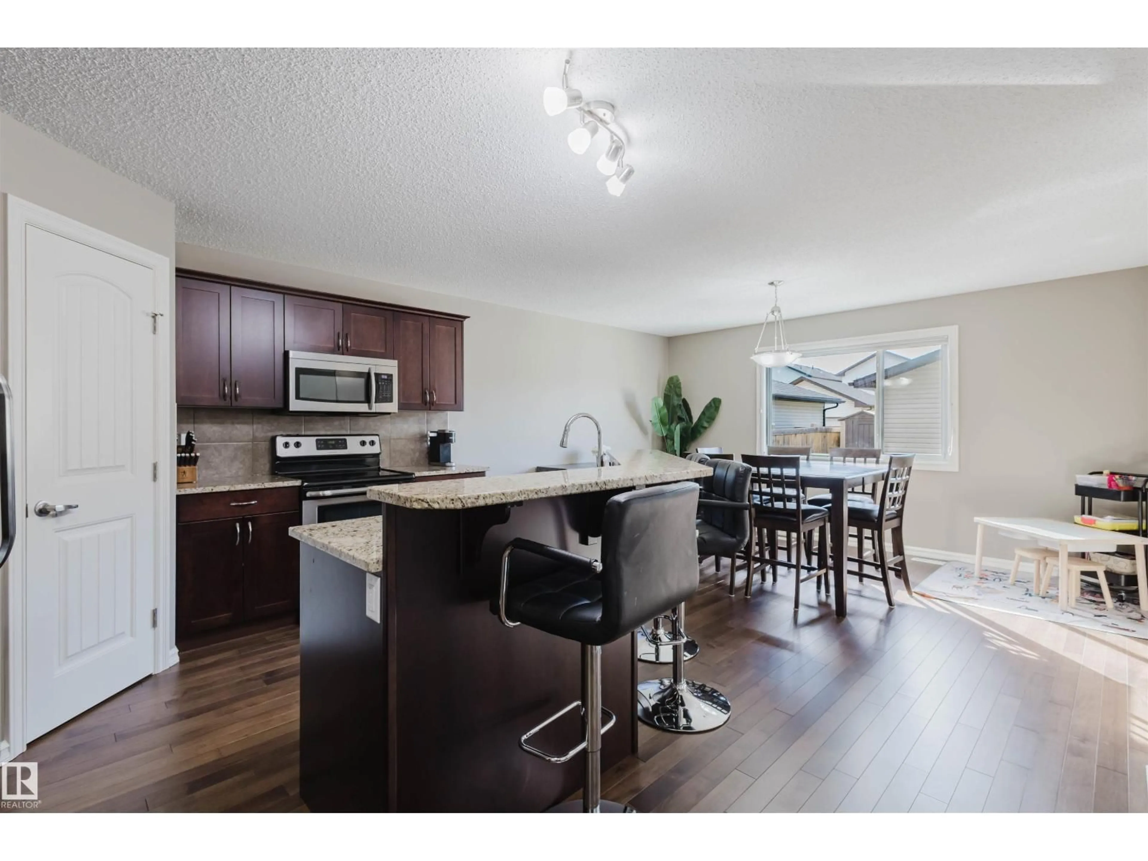Open concept kitchen, wood/laminate floor for NW - 9428 212 ST, Edmonton Alberta T5T4R3