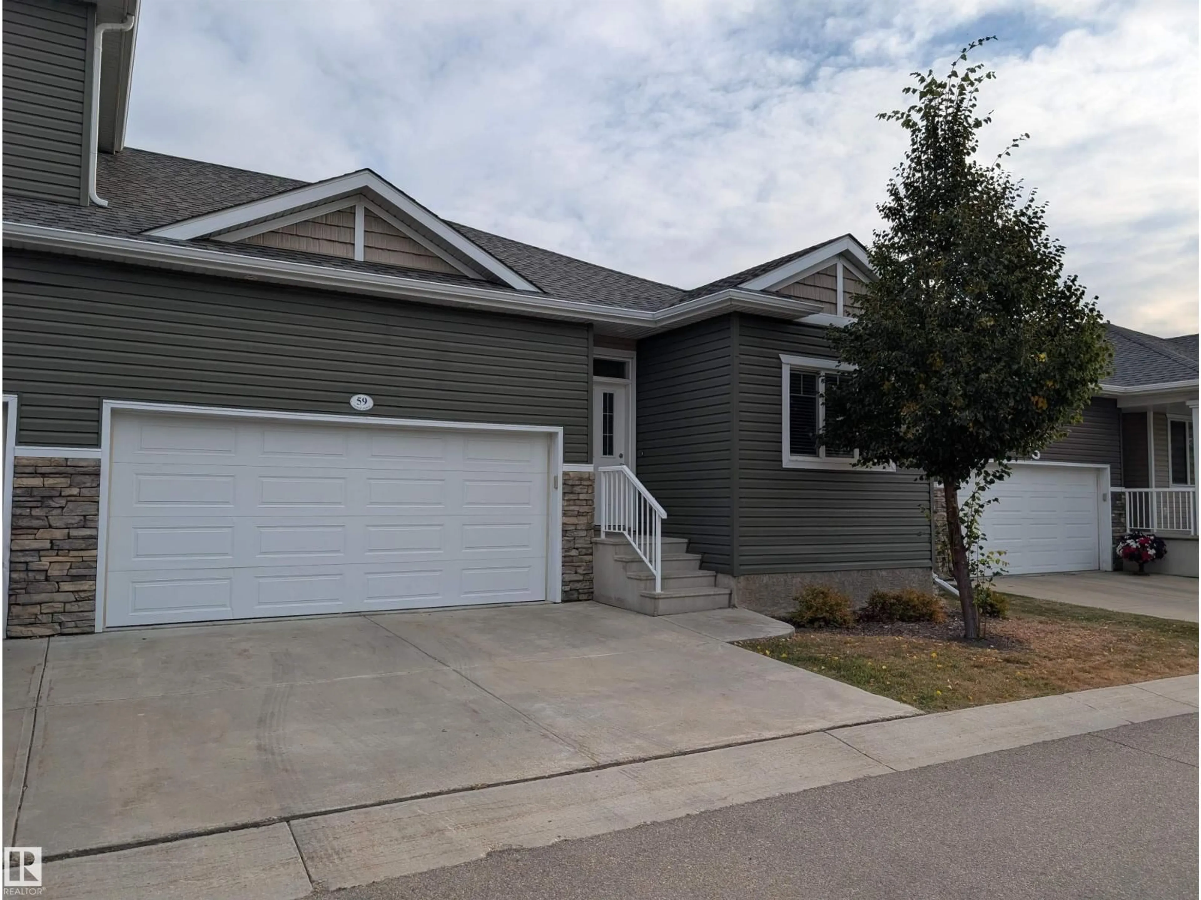 Home with vinyl exterior material, street for 59 18230 104A ST NW, Edmonton Alberta T5X0G9
