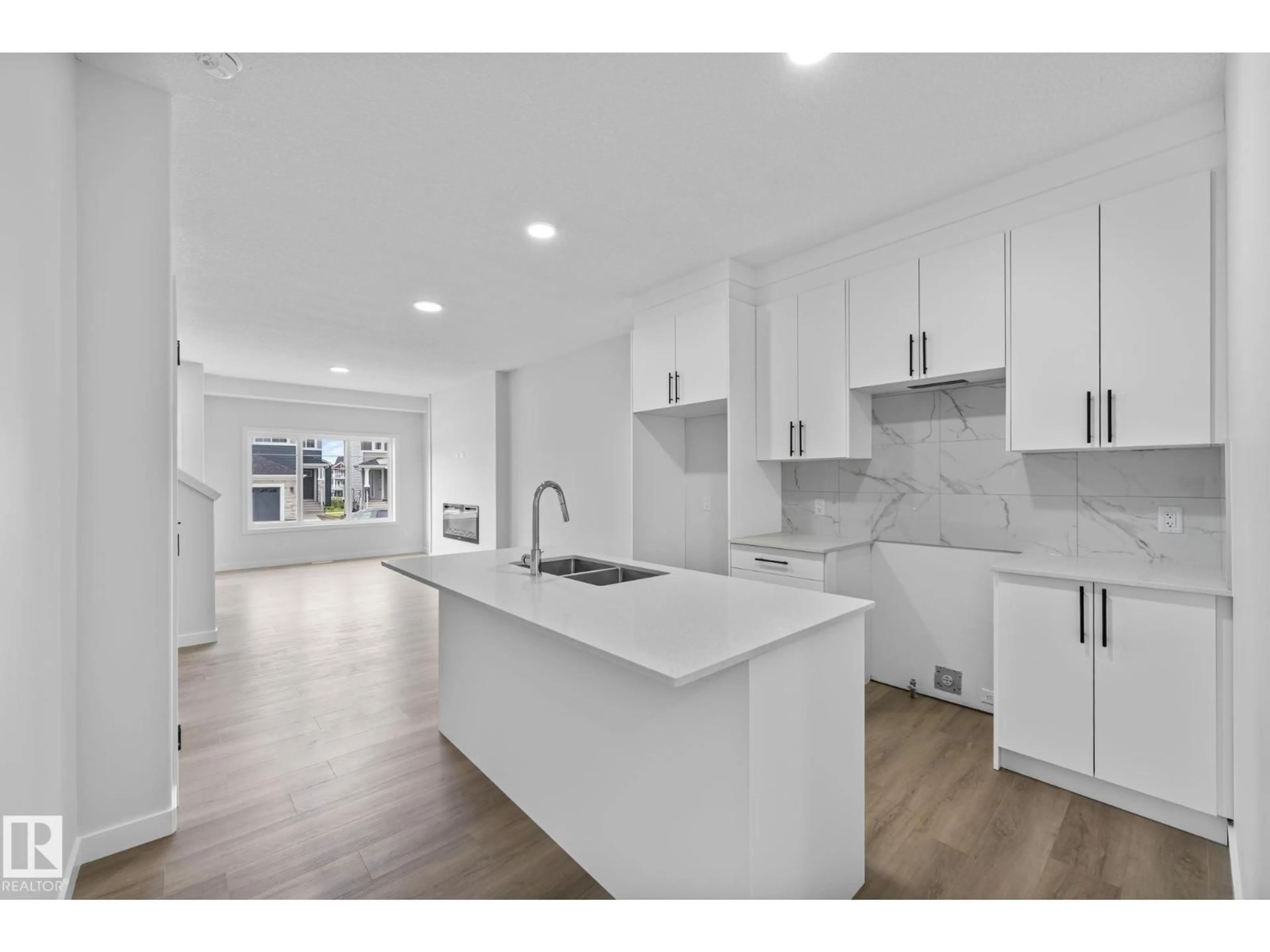 Open concept kitchen, ceramic/tile floor for SW - 16521 20 AV, Edmonton Alberta T6W5K1